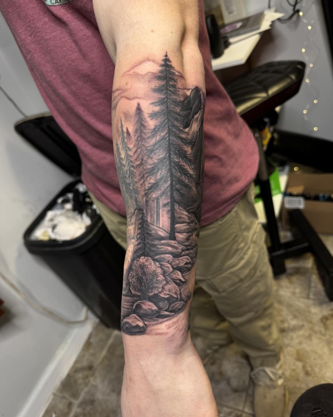 Forest landscape realism tattoo on the forearm by 𝔻𝕖𝕣𝕣𝕚𝕔𝕜 𝔹𝕦𝕪𝕖𝕒, East Aurora, New York