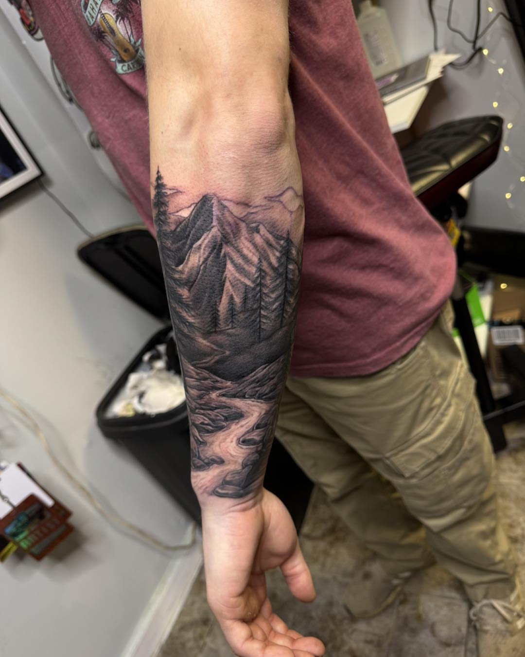 Mountain landscape realism tattoo on the forearm by 𝔻𝕖𝕣𝕣𝕚𝕔𝕜 𝔹𝕦𝕪𝕖𝕒, East Aurora, New York