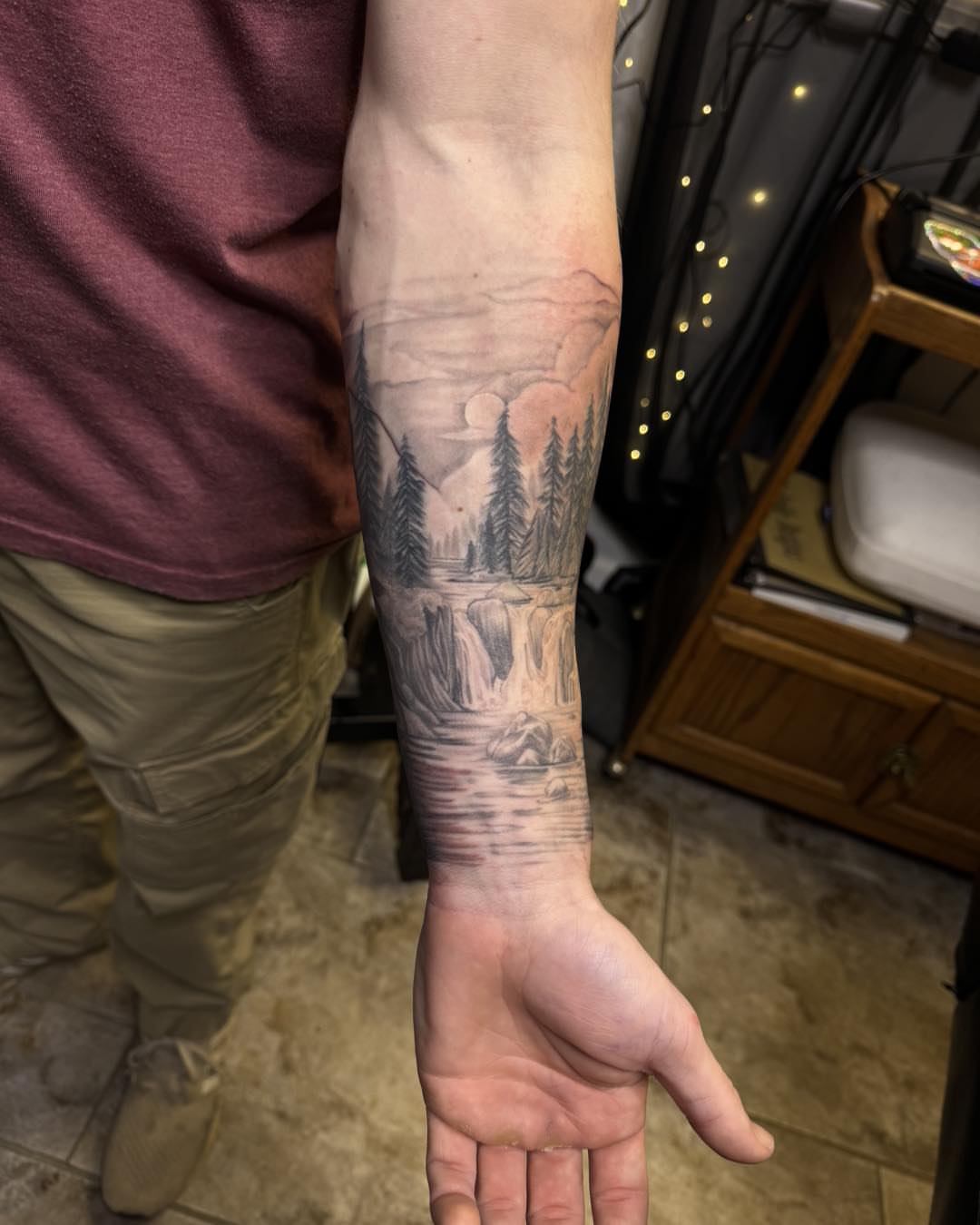 Landscape realism tattoo on the forearm by 𝔻𝕖𝕣𝕣𝕚𝕔𝕜 𝔹𝕦𝕪𝕖𝕒, East Aurora, New York