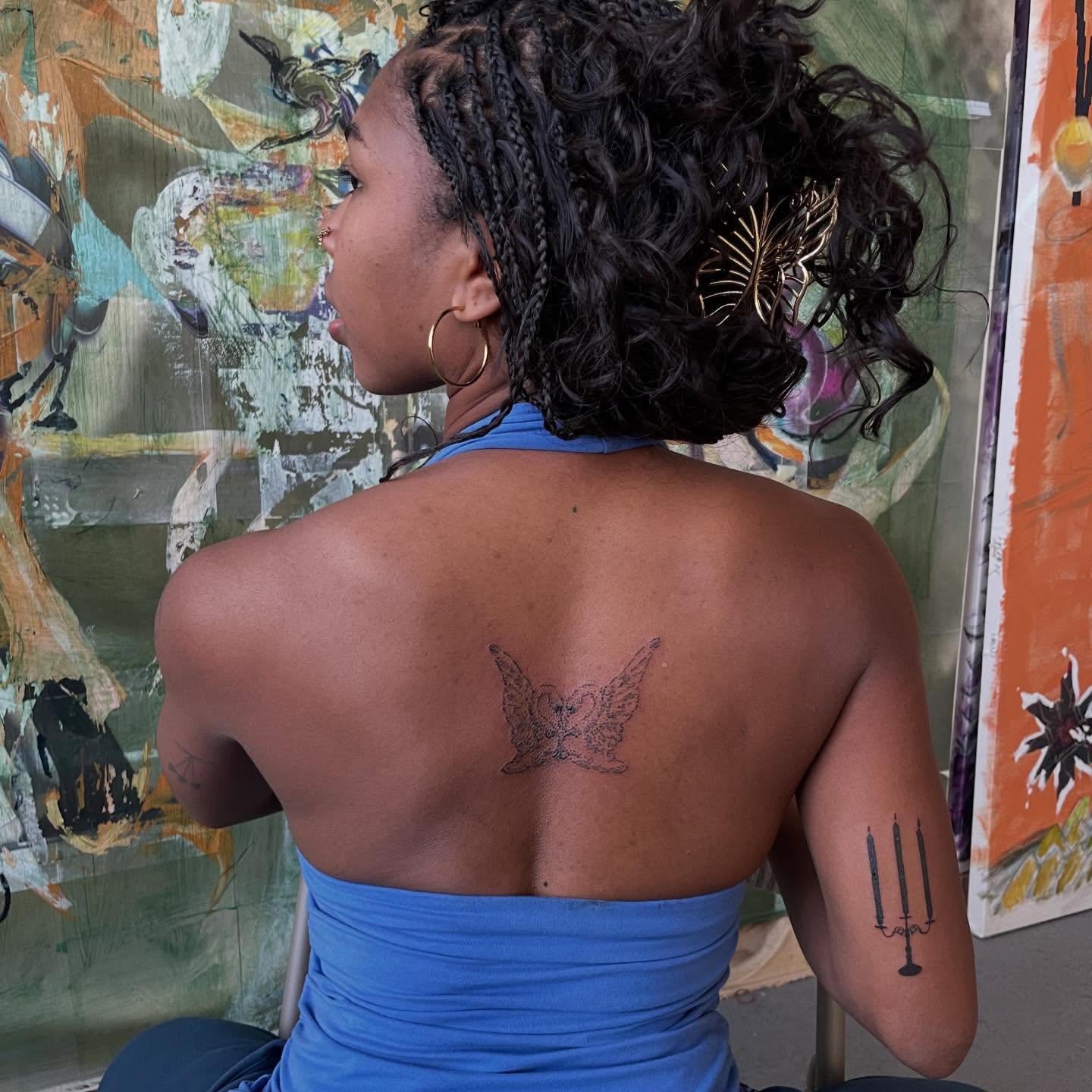 Butterfly black and grey tattoo on the back by bisabuelita