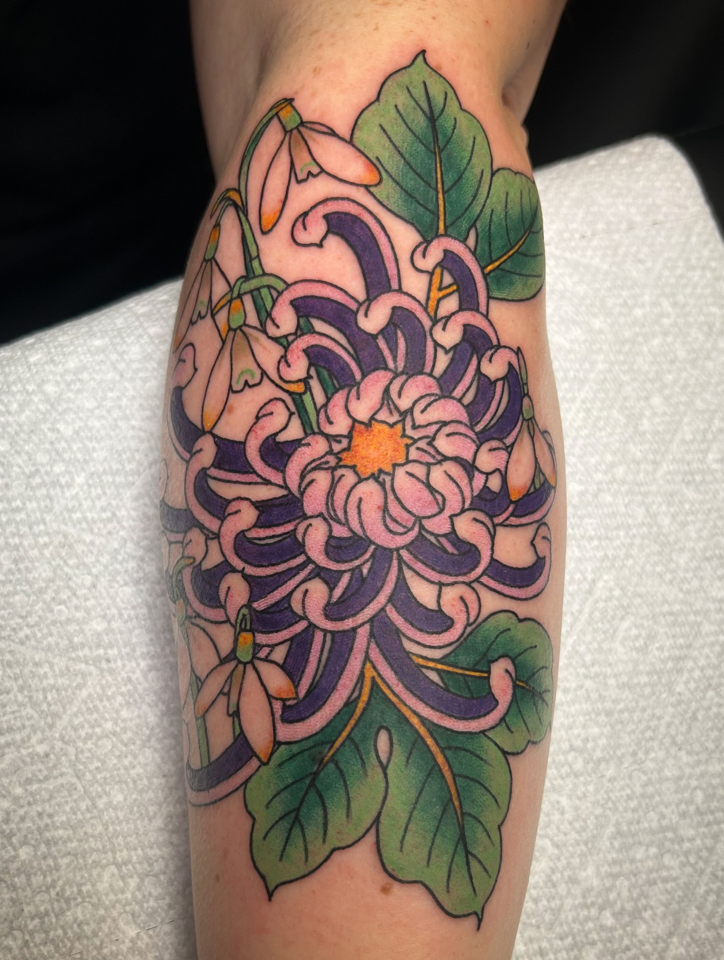 Chrysanthemum American traditional tattoo on the forearm by Jessica Oram Brockman, Dayton, Ohio