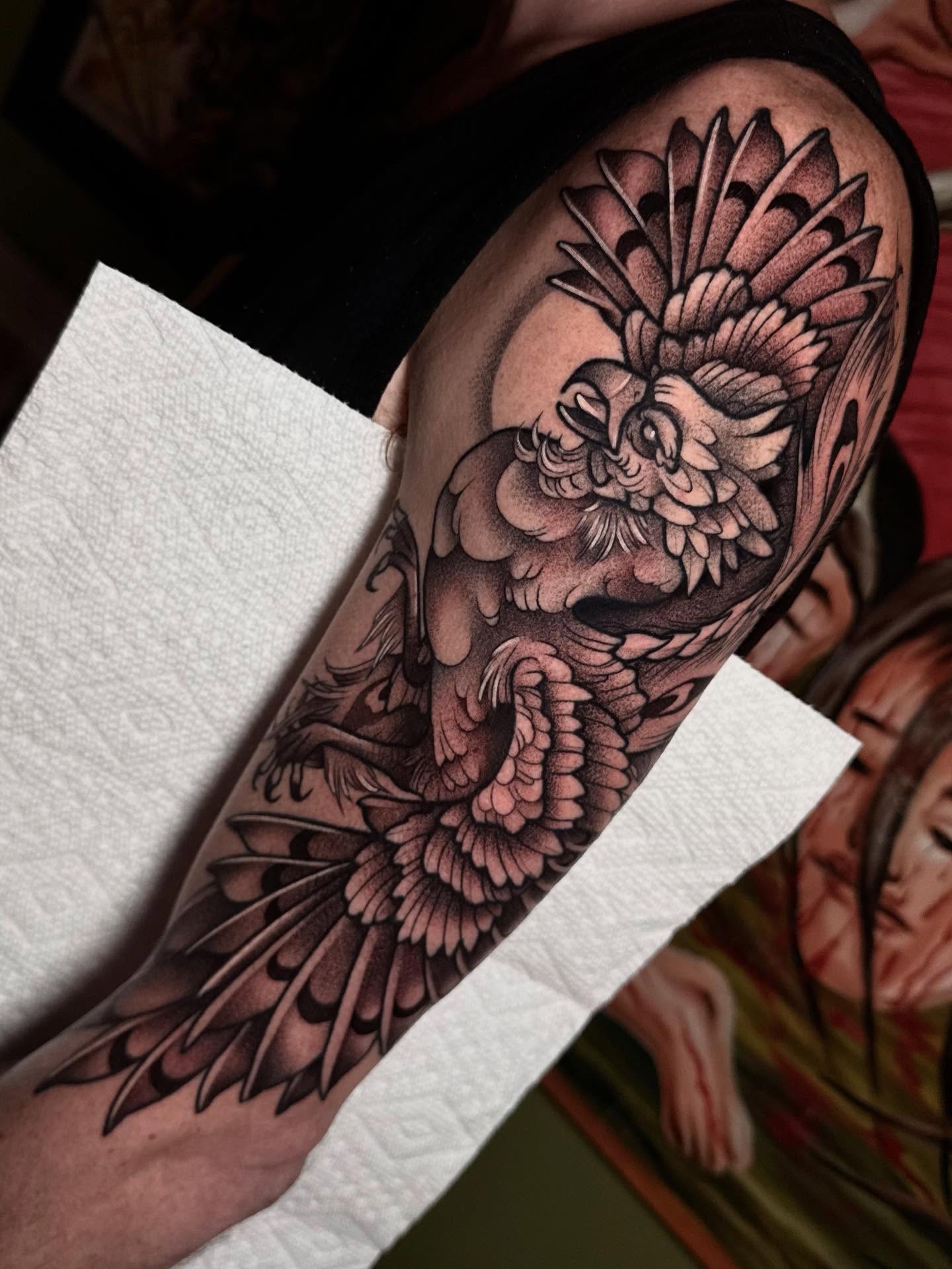 Owl black and grey tattoo on the forearm by Bell Bolton