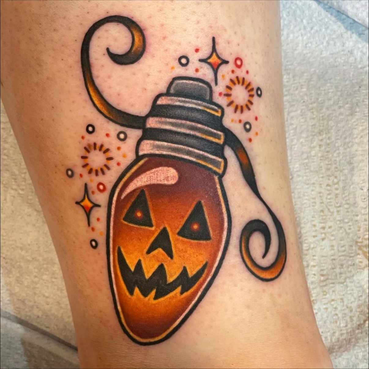 Jack-o'-lantern lantern American traditional tattoo on the forearm by Alexandra Fische