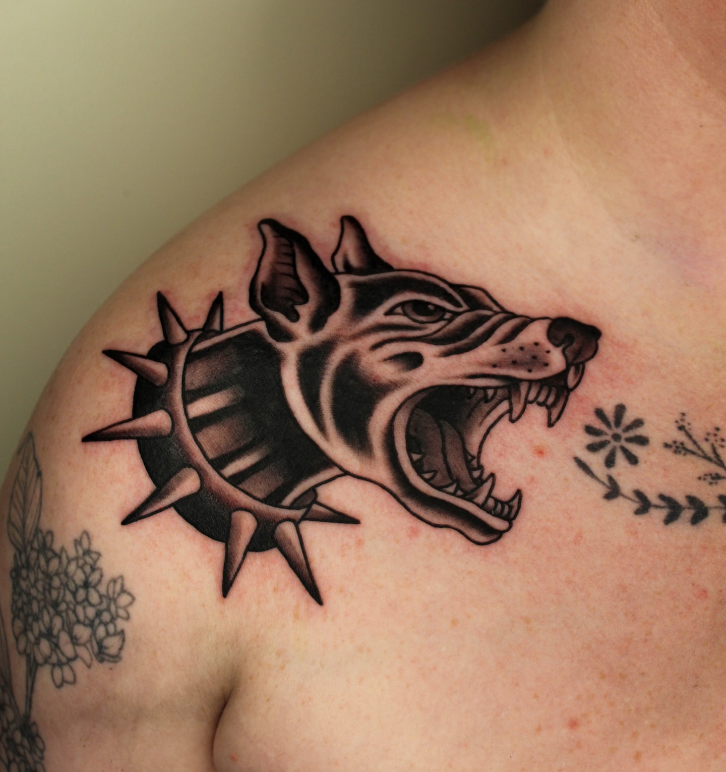 Wolf head with crown realism tattoo on the shoulder by Kehrmie Tattoos, Berkeley, California