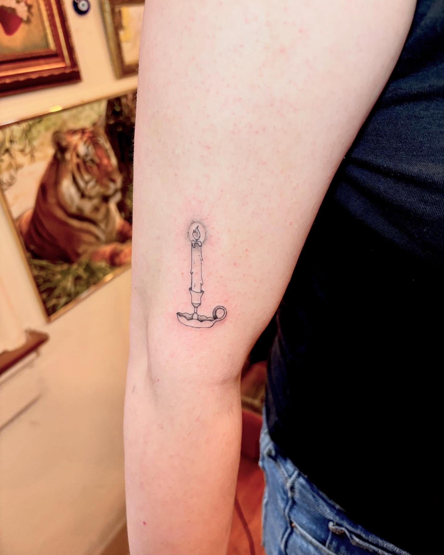 Candle black and grey tattoo on the forearm by madison, Cincinnati