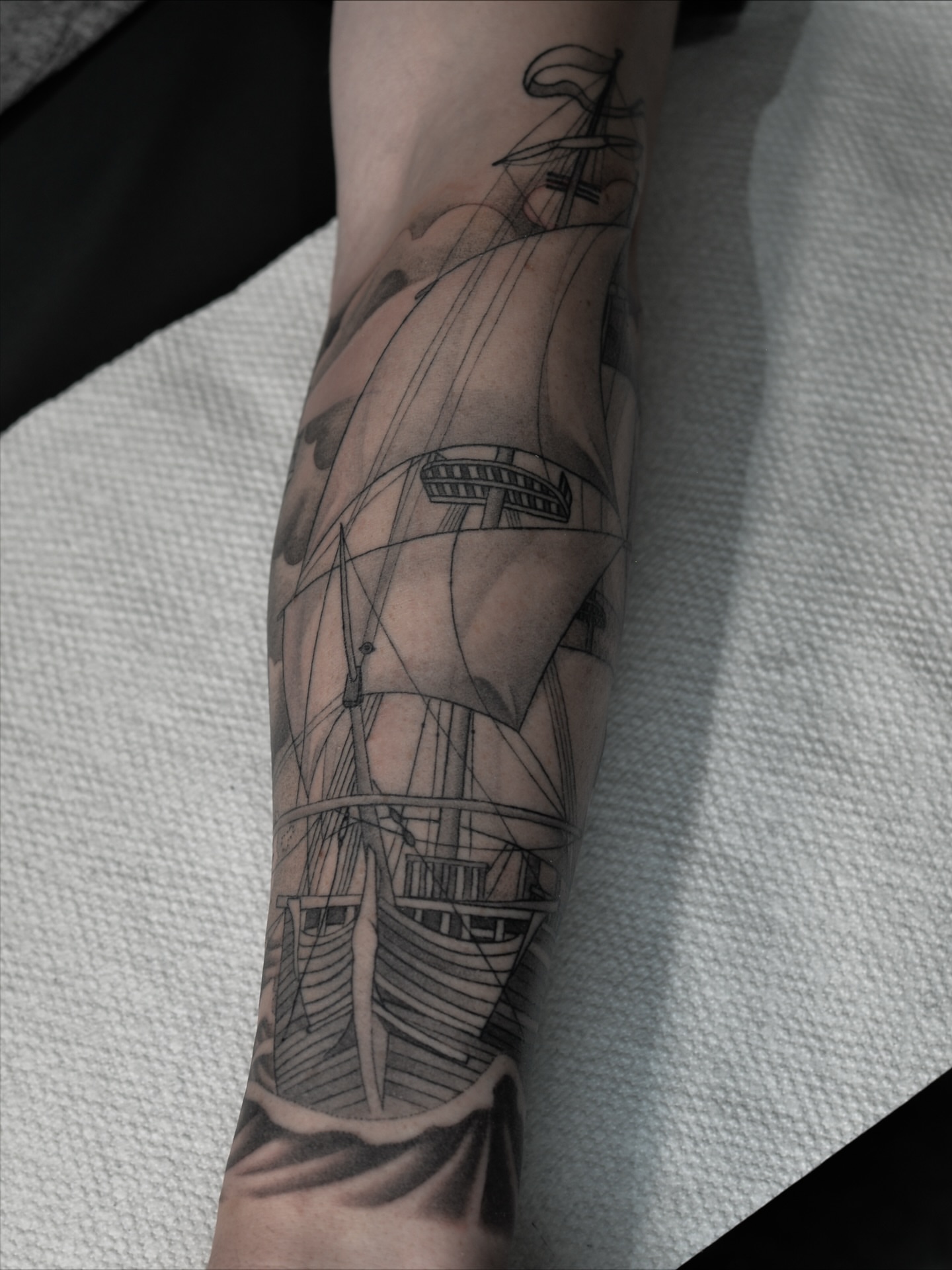 Ship black and grey tattoo on the forearm by zak brochu, Windsor, Ontario