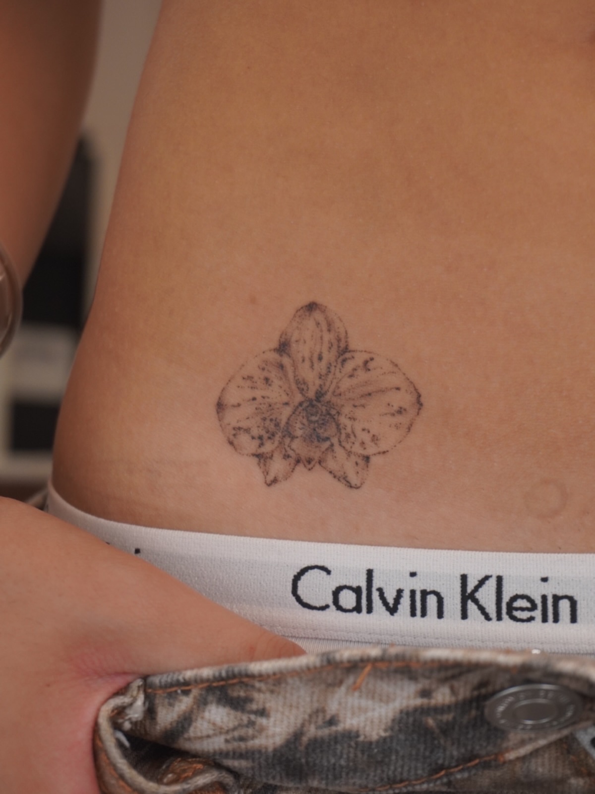 Orchid black and grey tattoo on the thigh by Sun Child Tattoo 🌻