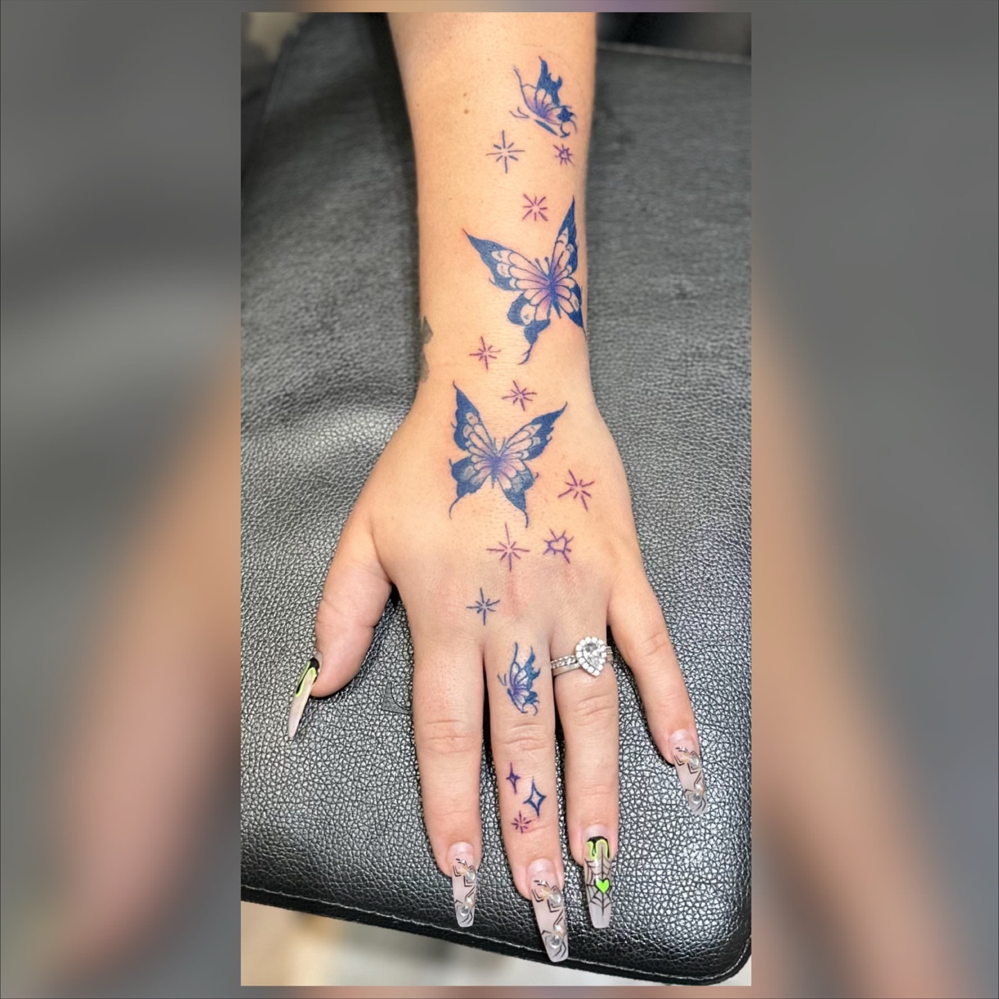 Butterflies and stars dotwork tattoo on the hand by Ink’d by Reina 🖤, Colorado Springs, Colorado
