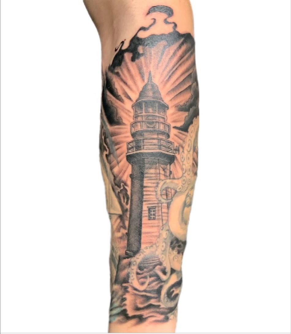 Lighthouse neo-traditional tattoo on the forearm by Shane Montie, Killeen, Texas