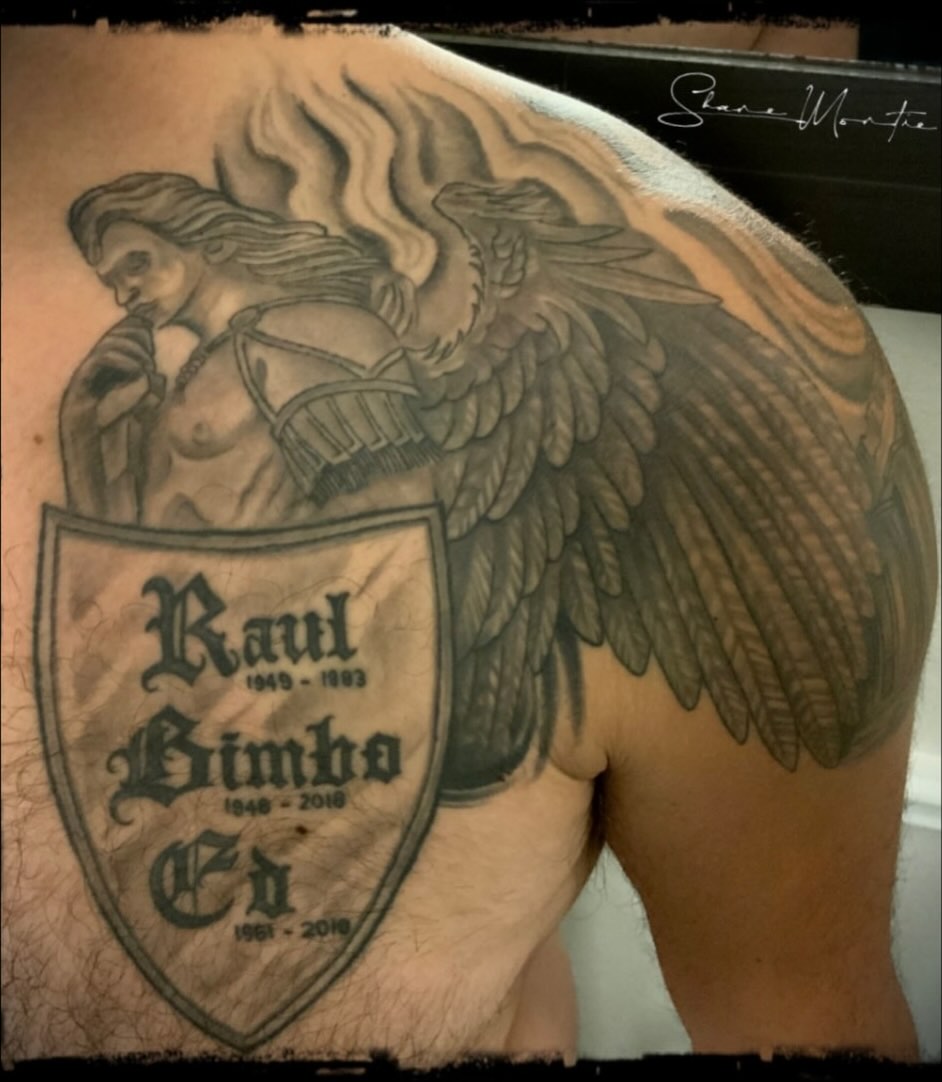Winged angel with shield realism tattoo on the shoulder by Shane Montie, Killeen, Texas