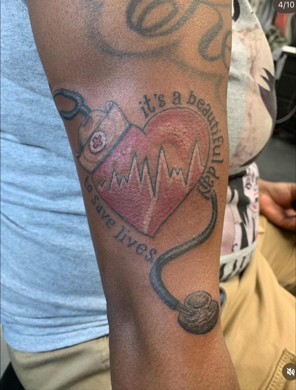 Heart with stethoscope black and grey tattoo on the forearm by Shane Montie, Killeen, Texas