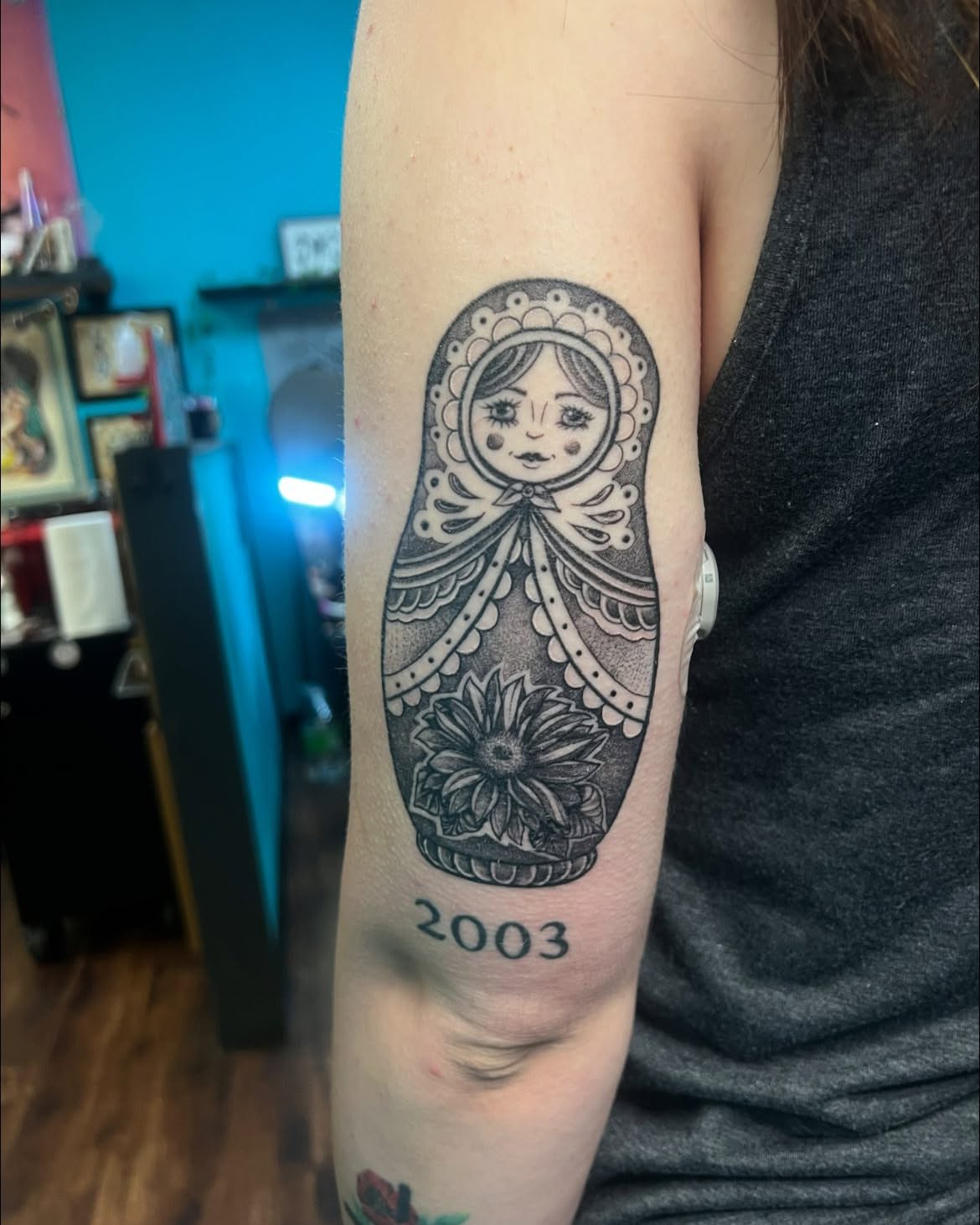 Matryoshka doll black and grey tattoo on the forearm by Chelsea Nichole