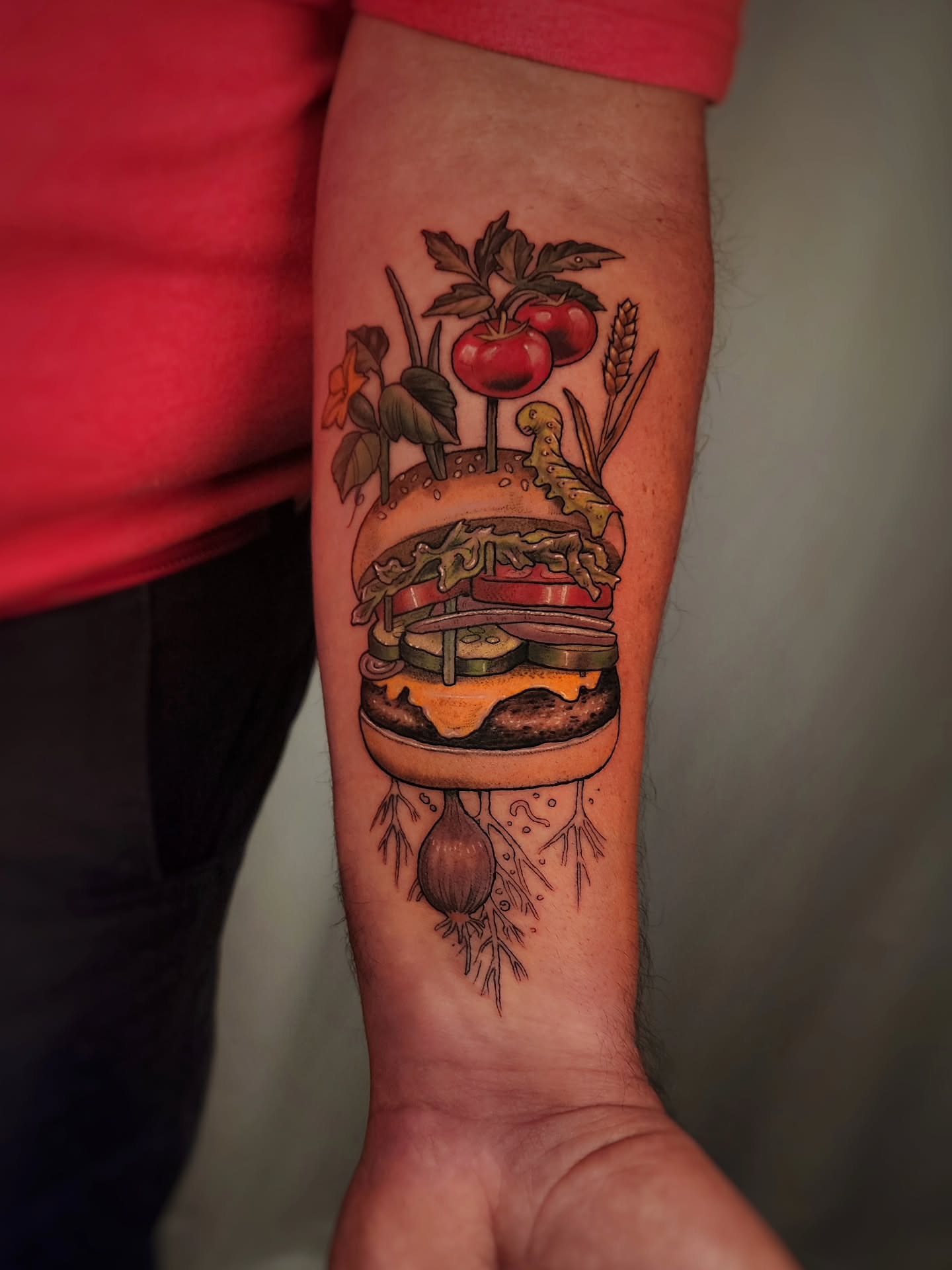 Hamburger realism tattoo on the forearm by Whitney Caskey