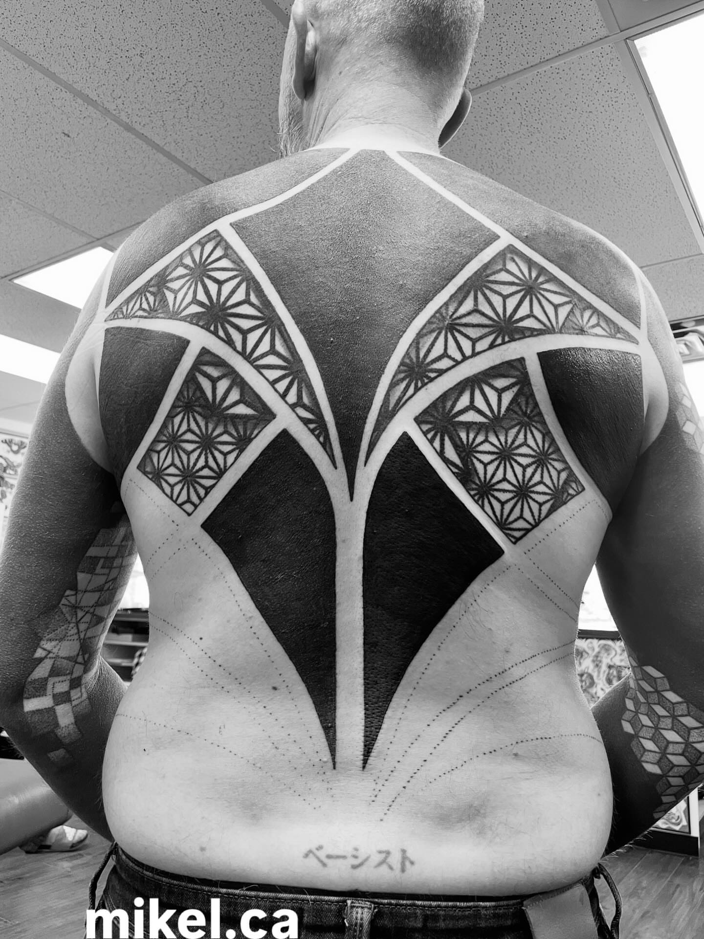 Geometric pattern geometric tattoo on the back by mikel_tattoosangha