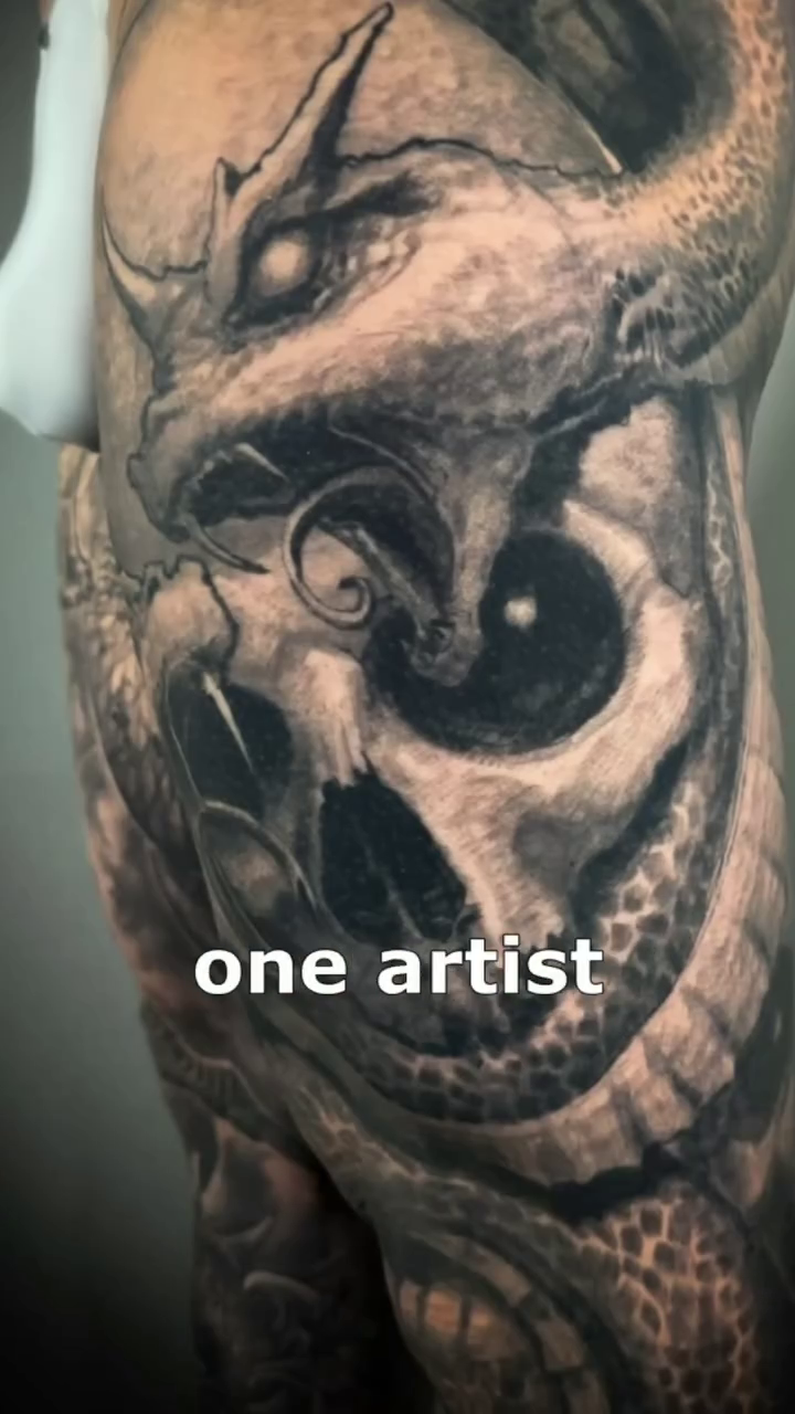 Dragon skull dark realism tattoo by Paul Booth