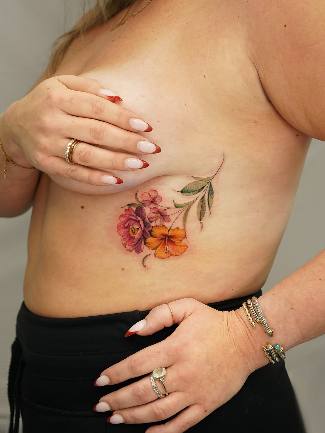 Floral arrangement neo-traditional tattoo on the chest by Valentina