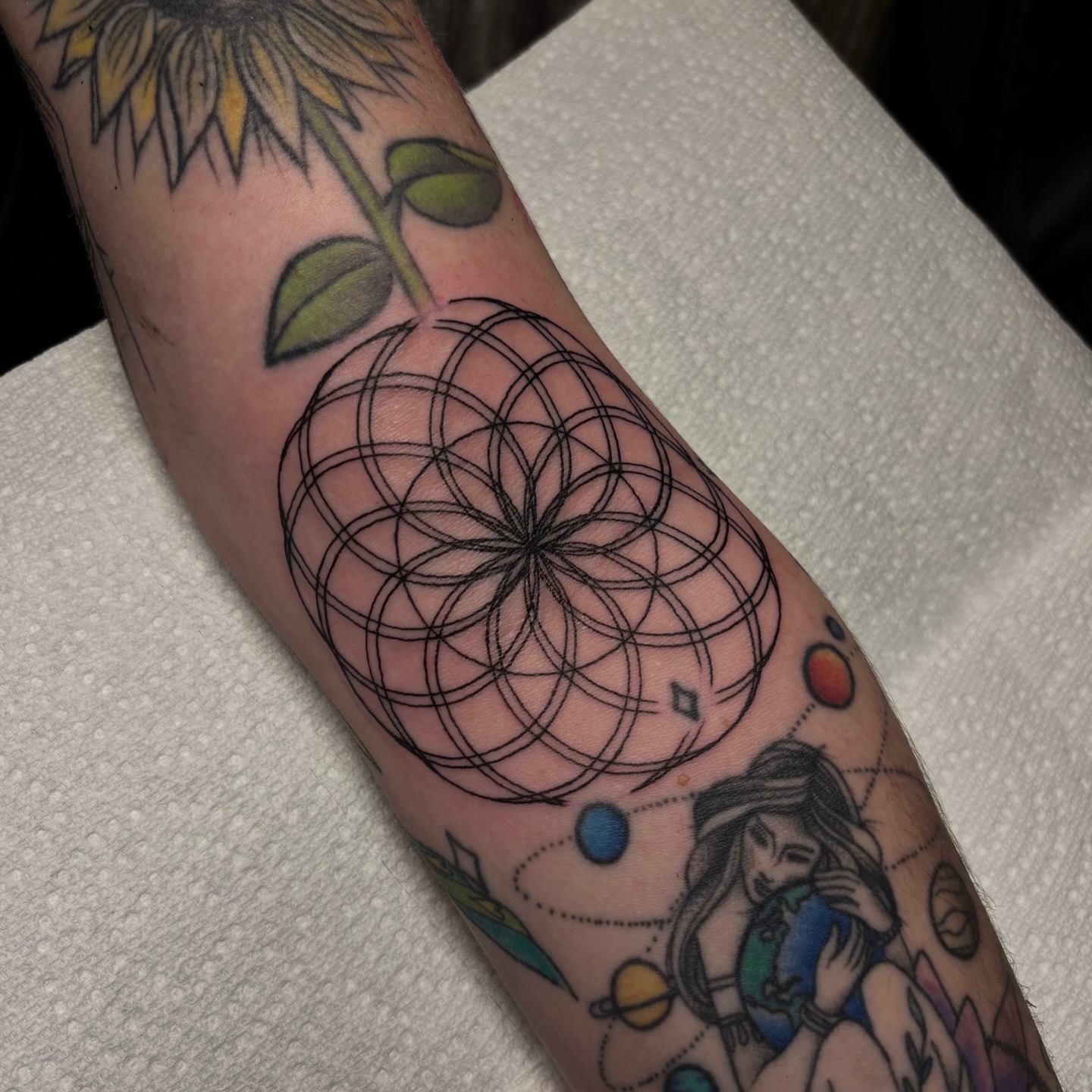 Geometric design geometric tattoo on the forearm by Dyllan Shipley