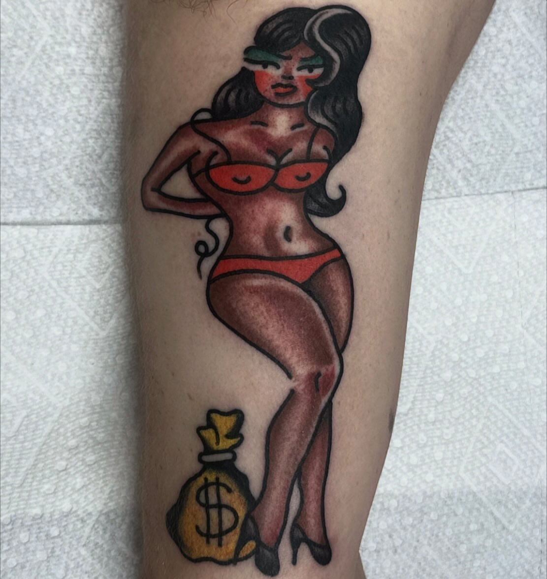 Pin-up girl American traditional tattoo on the leg by Rob, Nashville, Tennessee