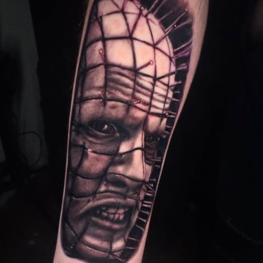Pinhead realism tattoo on the forearm by Sideshow Danny