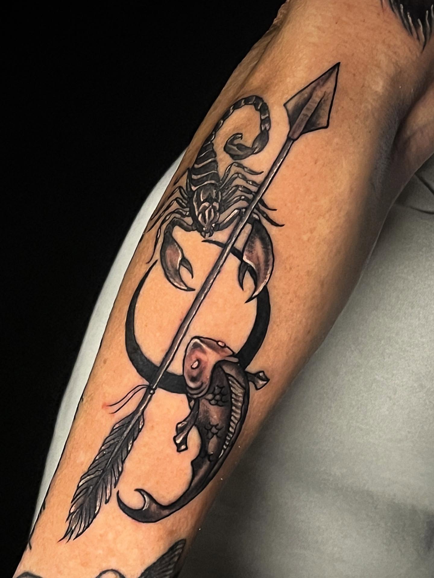 Scorpion and arrow black and grey tattoo on the forearm by Suzanne B