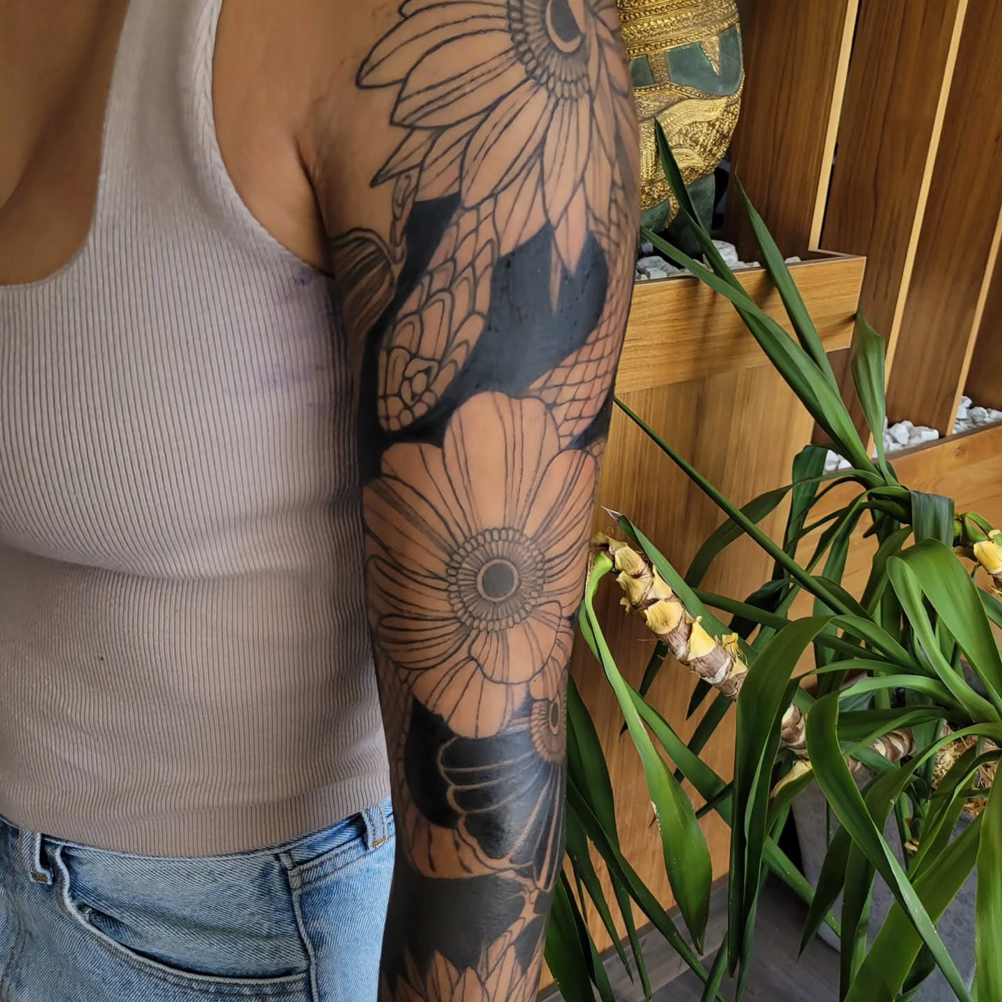 Sunflower black and grey tattoo on the forearm by Taylor