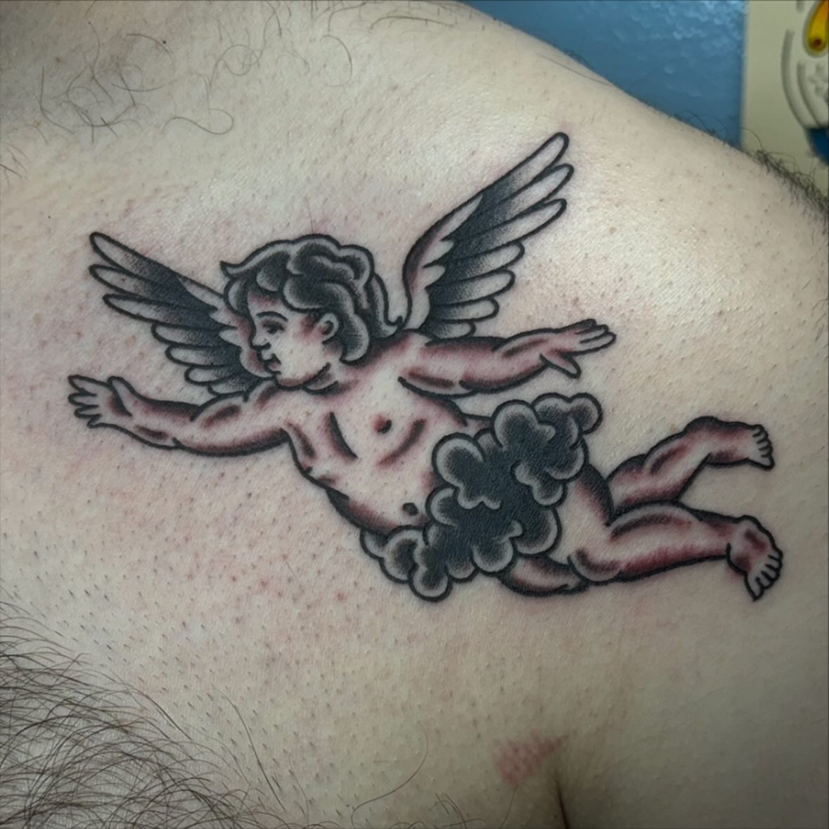 Cherub American traditional tattoo on the back by ๐๐๐ฑ๐ฑ๐ฌ๐ฌ ๐๐ฏ๐ฑ๐ฆ๐ฐ๐ฑ