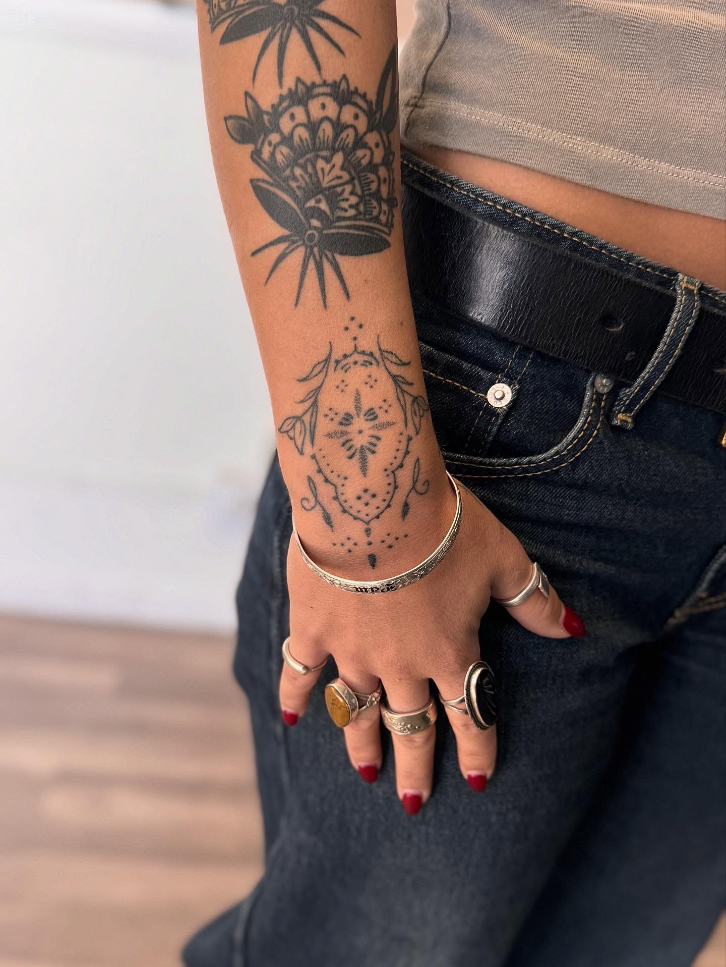 Floral bouquet American traditional tattoo on the forearm by Jessica Abbey