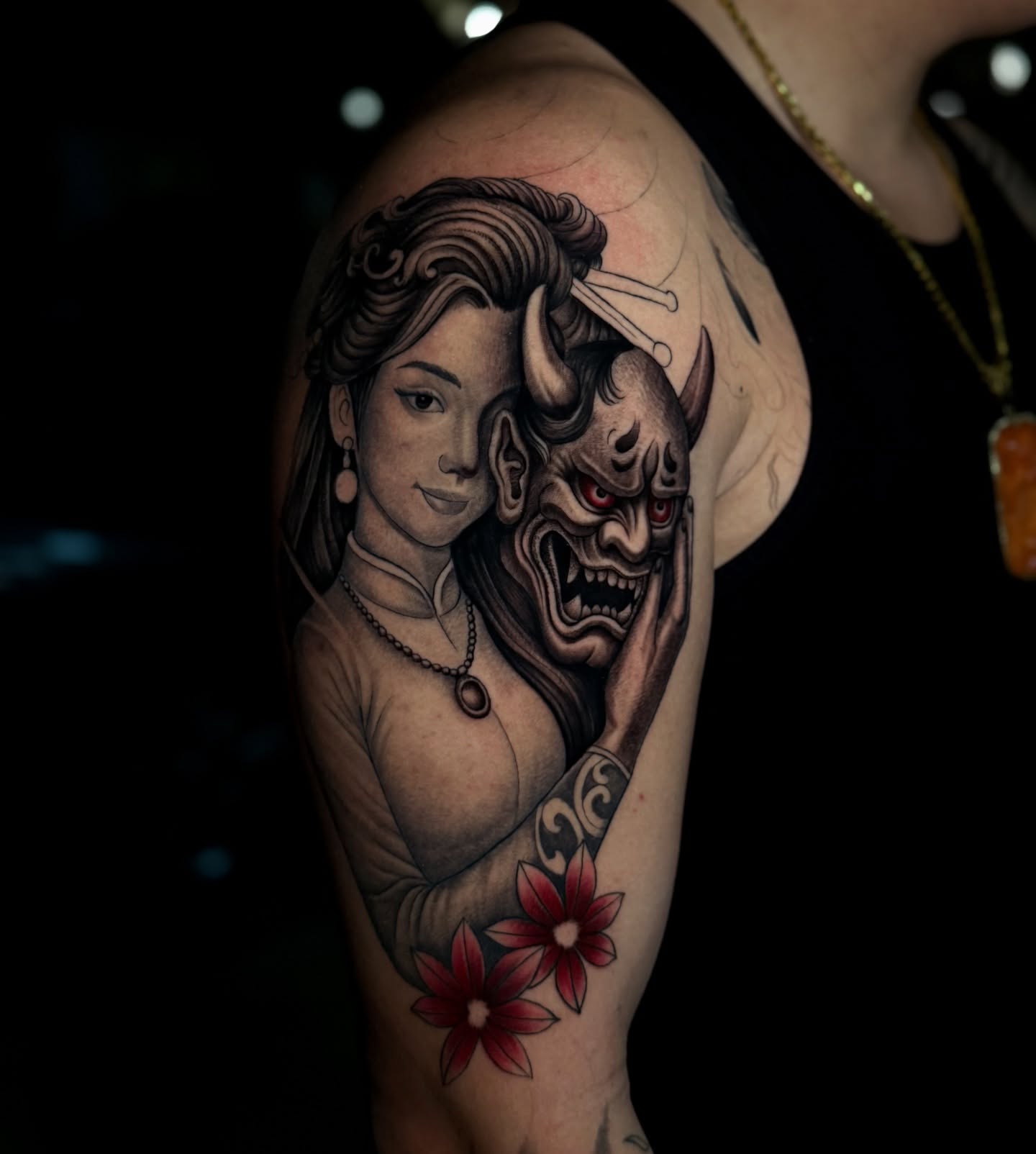 Woman and demon japanese irezumi tattoo on the upper arm by Anh Nguyen