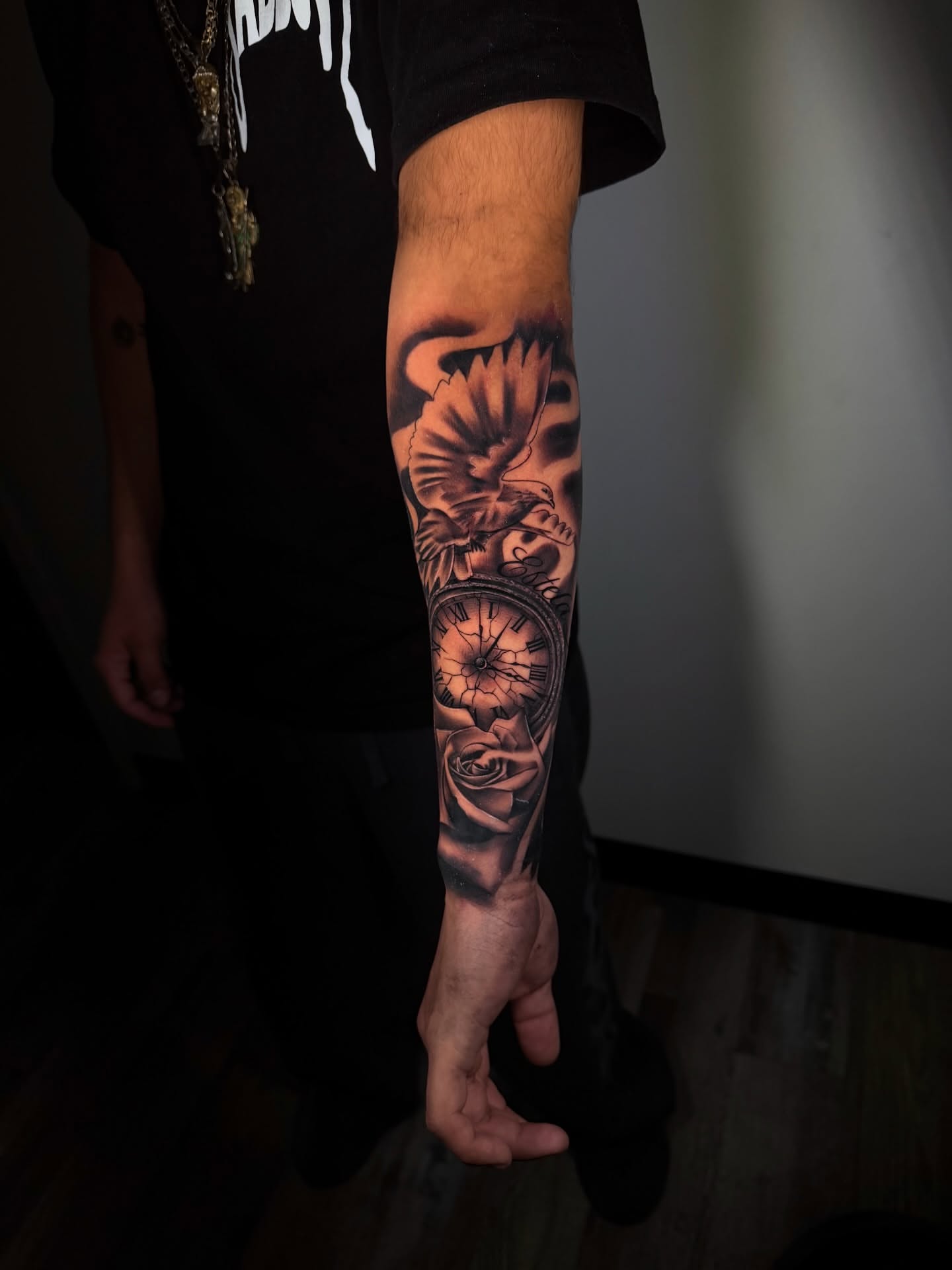 Clock and rose realism tattoo on the forearm by Aaron Saenz jr
