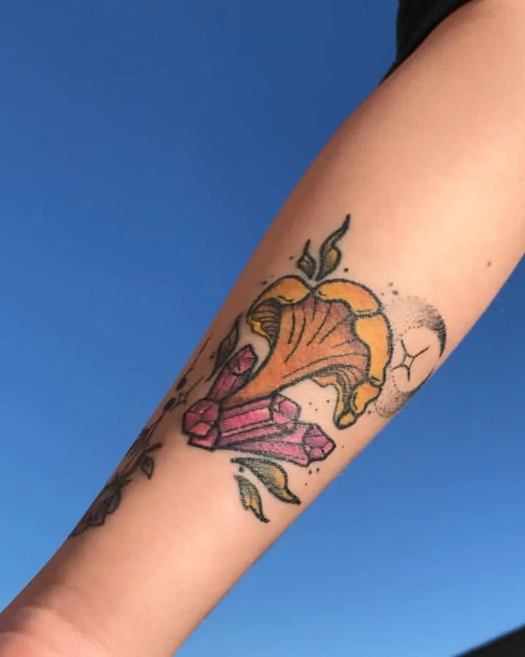 Flower and crystals new school tattoo on the forearm by Kim