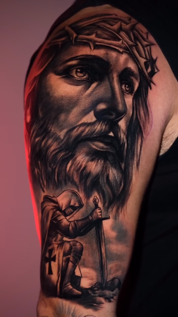 Jesus Christ with a kneeling figure realism tattoo by Luis Arenas