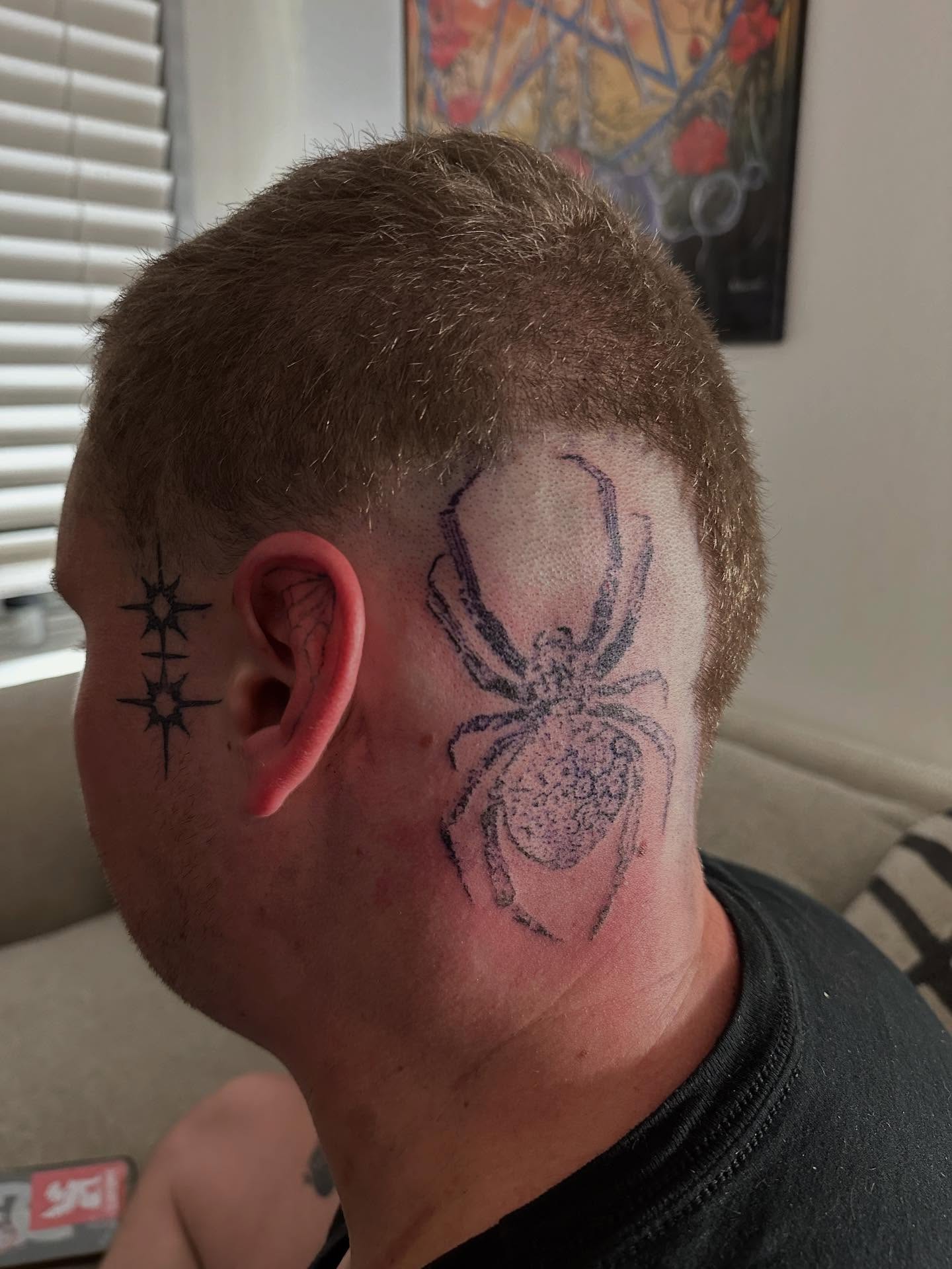 Spider black and grey tattoo on the head by Swag Originator