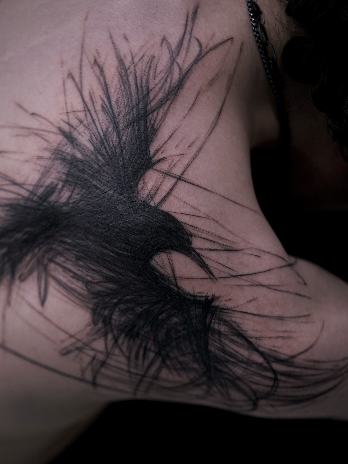 Feather black and grey tattoo on the shoulder by Young one 영원