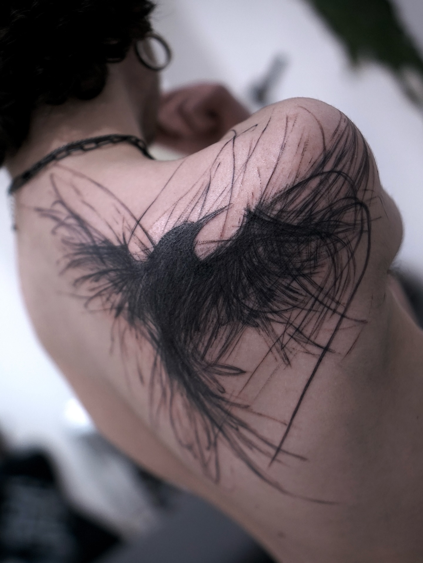 Feather black and grey tattoo on the shoulder by Young one 영원