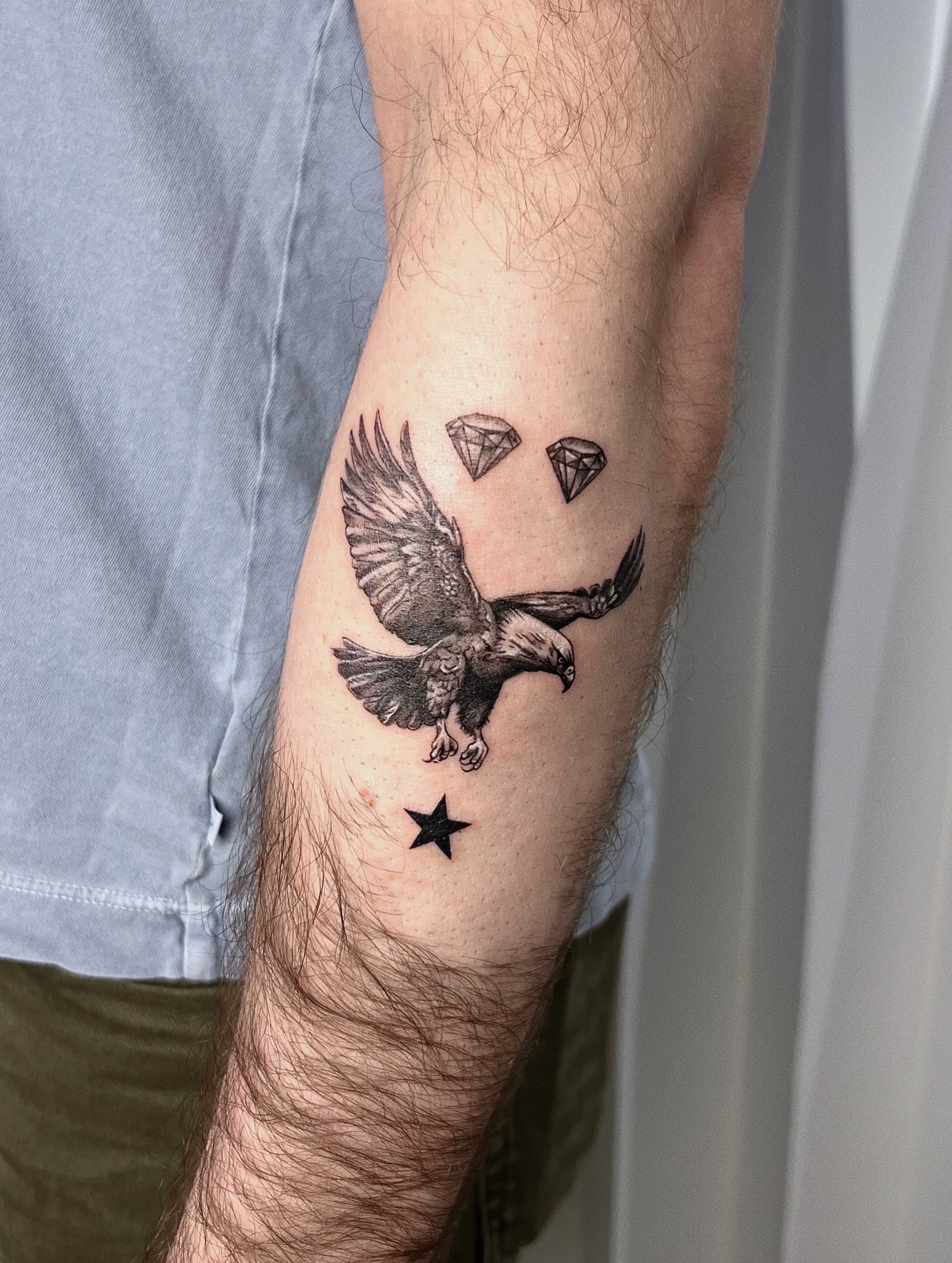 Eagle and diamonds realism tattoo on the forearm by Soy 🫛