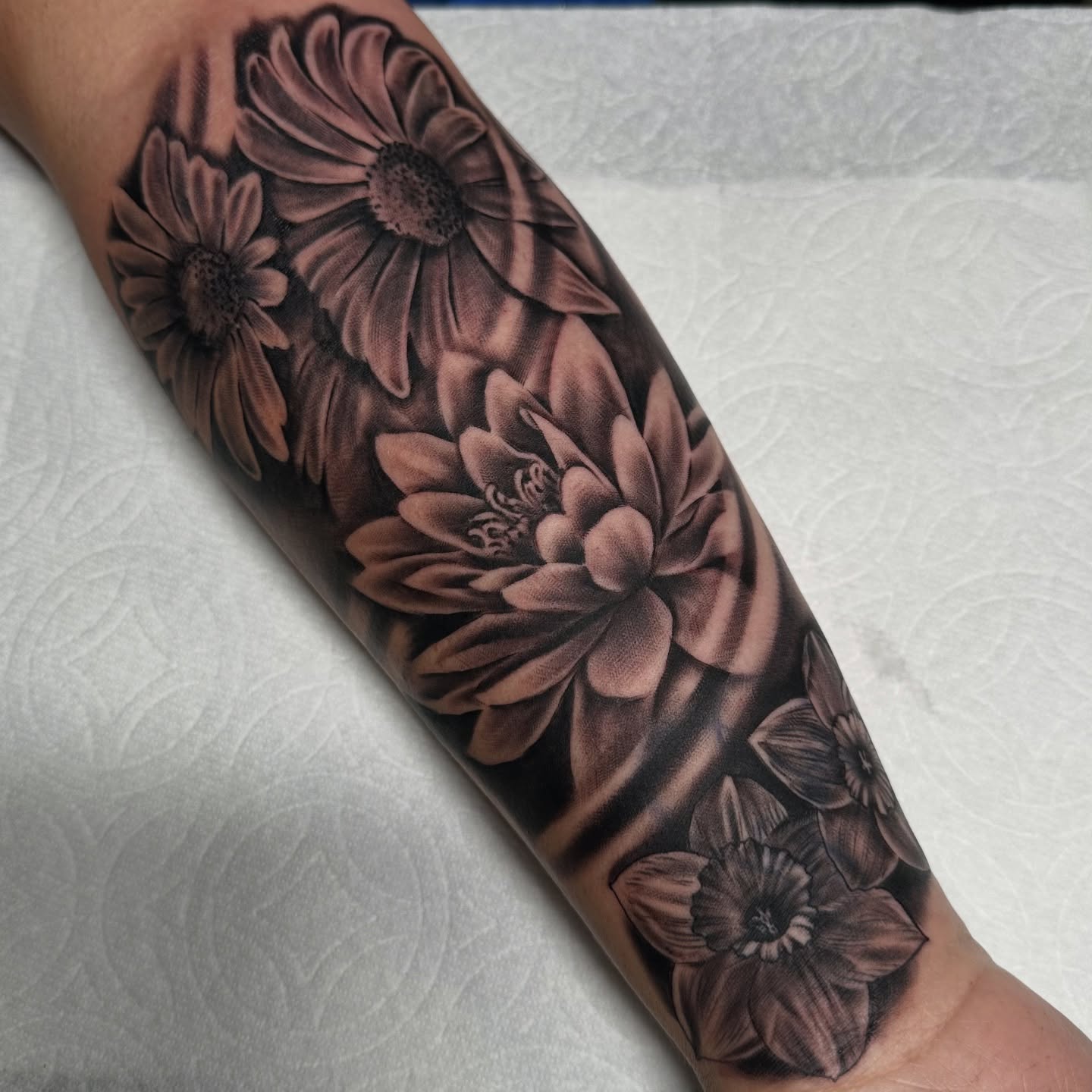 Flowers realism tattoo on the forearm by Yari, Los Angeles, California