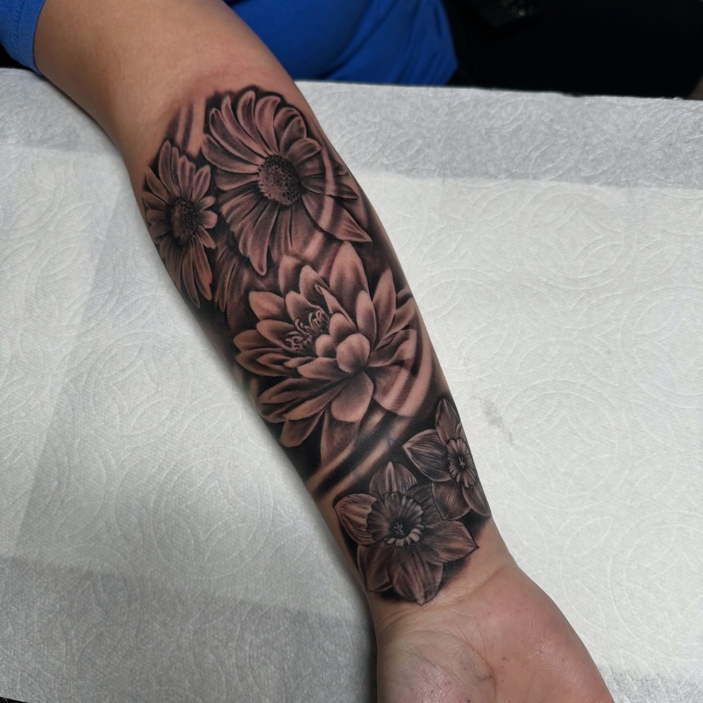Flowers realism tattoo on the forearm by Yari, Los Angeles, California
