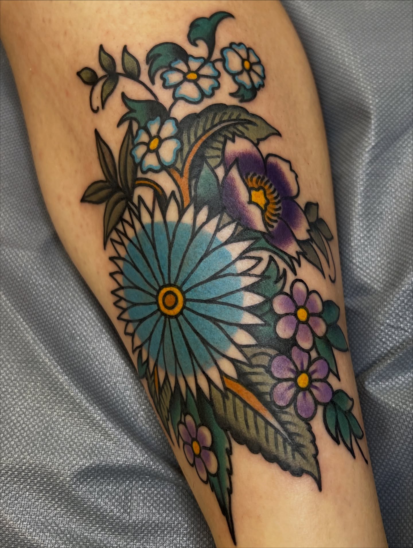 Floral bouquet American traditional tattoo on the forearm by morganhabe