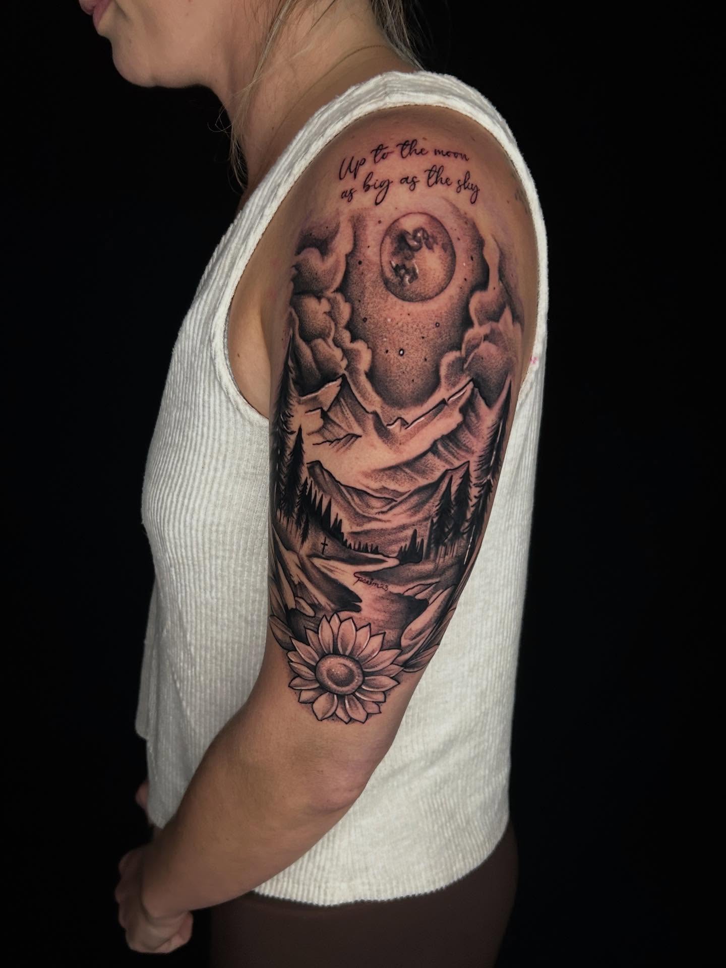 Moon and landscape realism tattoo on the upper arm by Haleigh Cunningham, Charlotte, North Carolina
