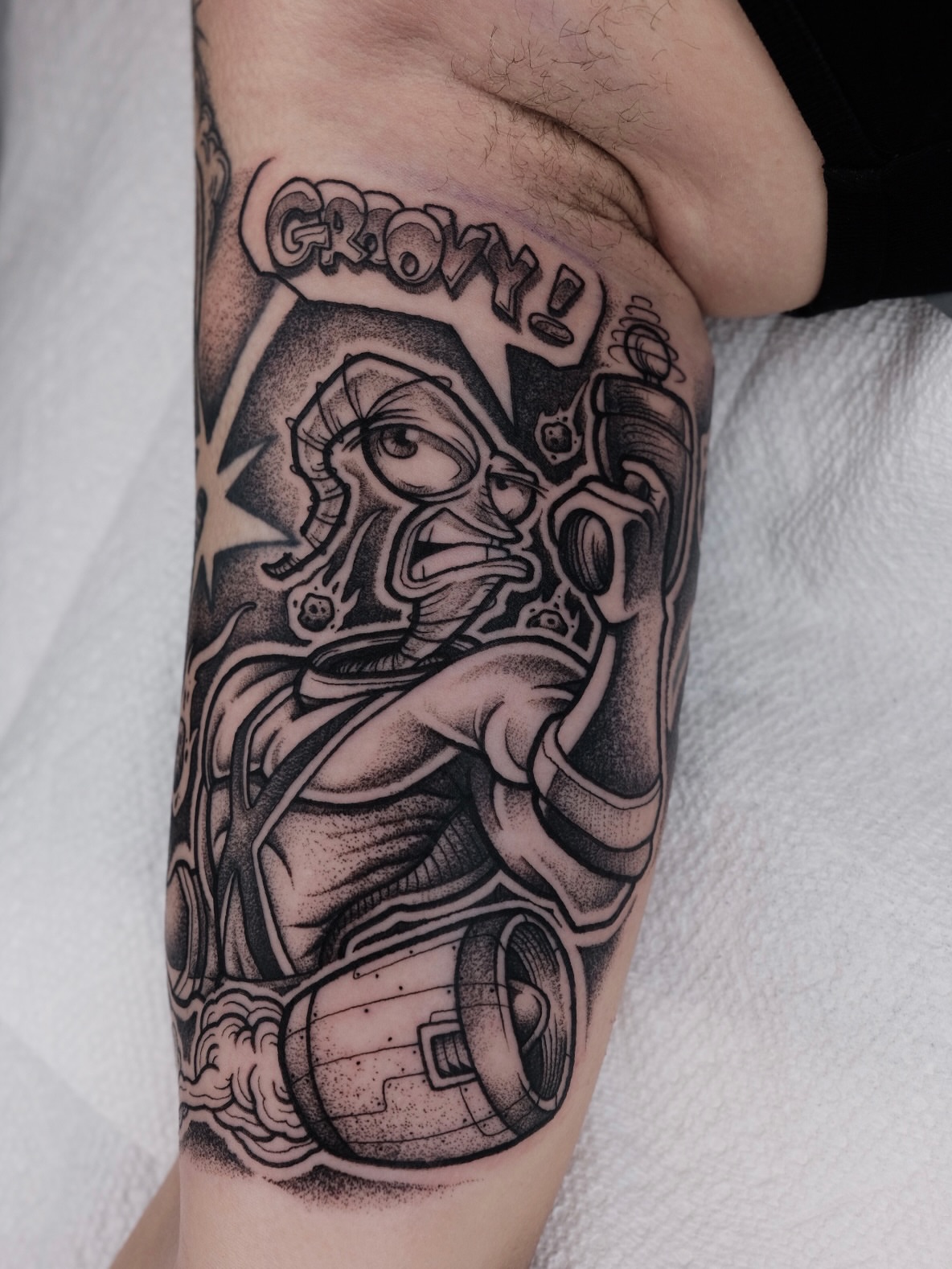 Robot character dotwork tattoo on the forearm by Kyle Patrick