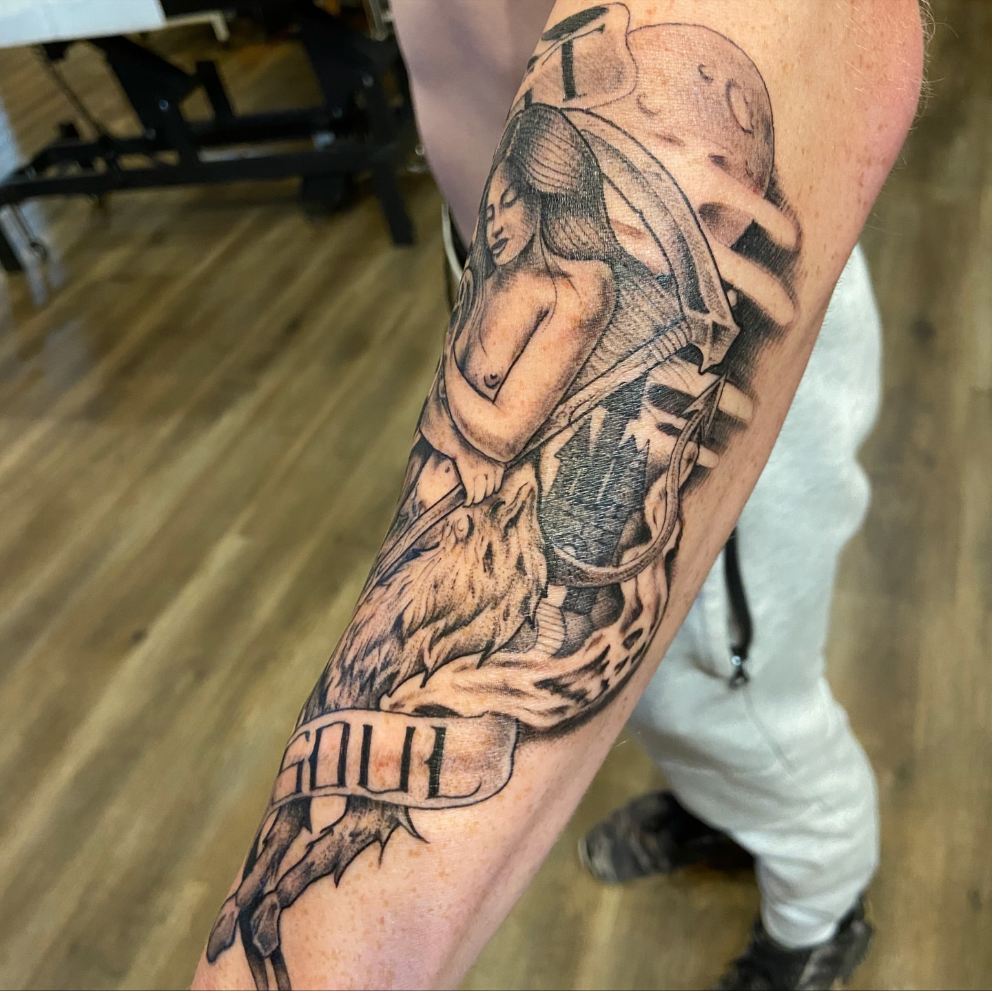 Woman with wings realism tattoo on the forearm by Anthony Robles