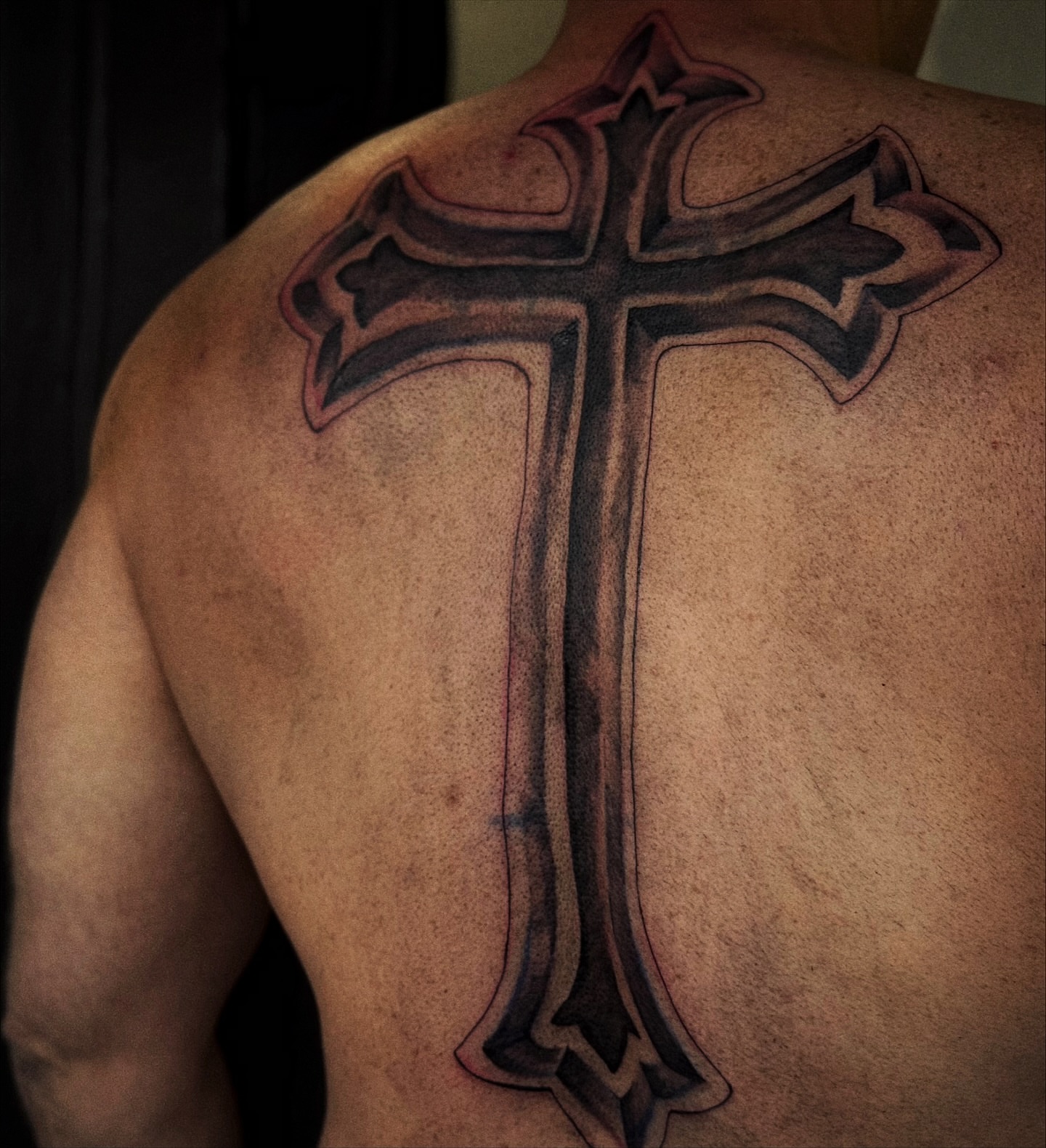 Cross black and grey tattoo on the back by 𝙹𝙰𝚉𝚉 𝙲𝙷𝙰𝙾