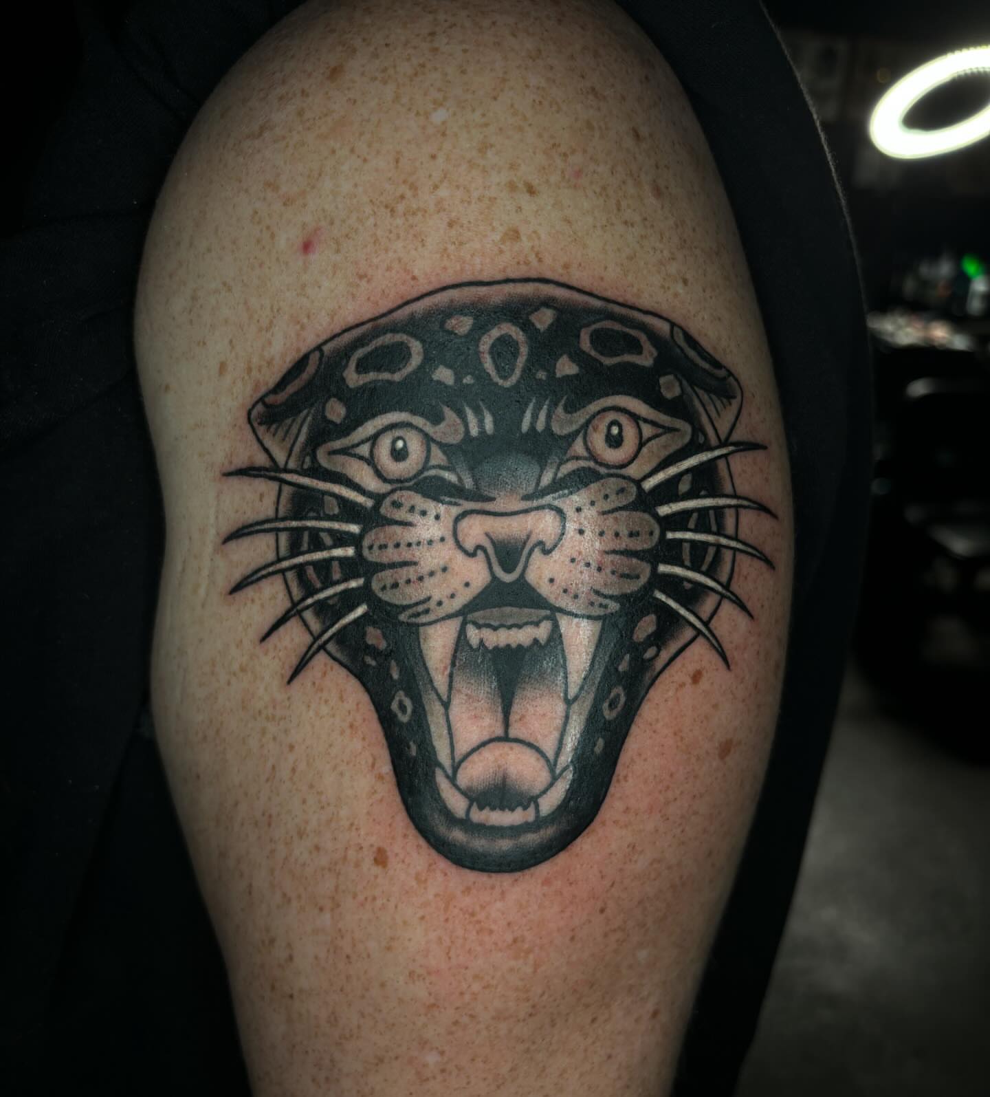 Jaguar head black and grey tattoo on the shoulder by Brett Ferguson