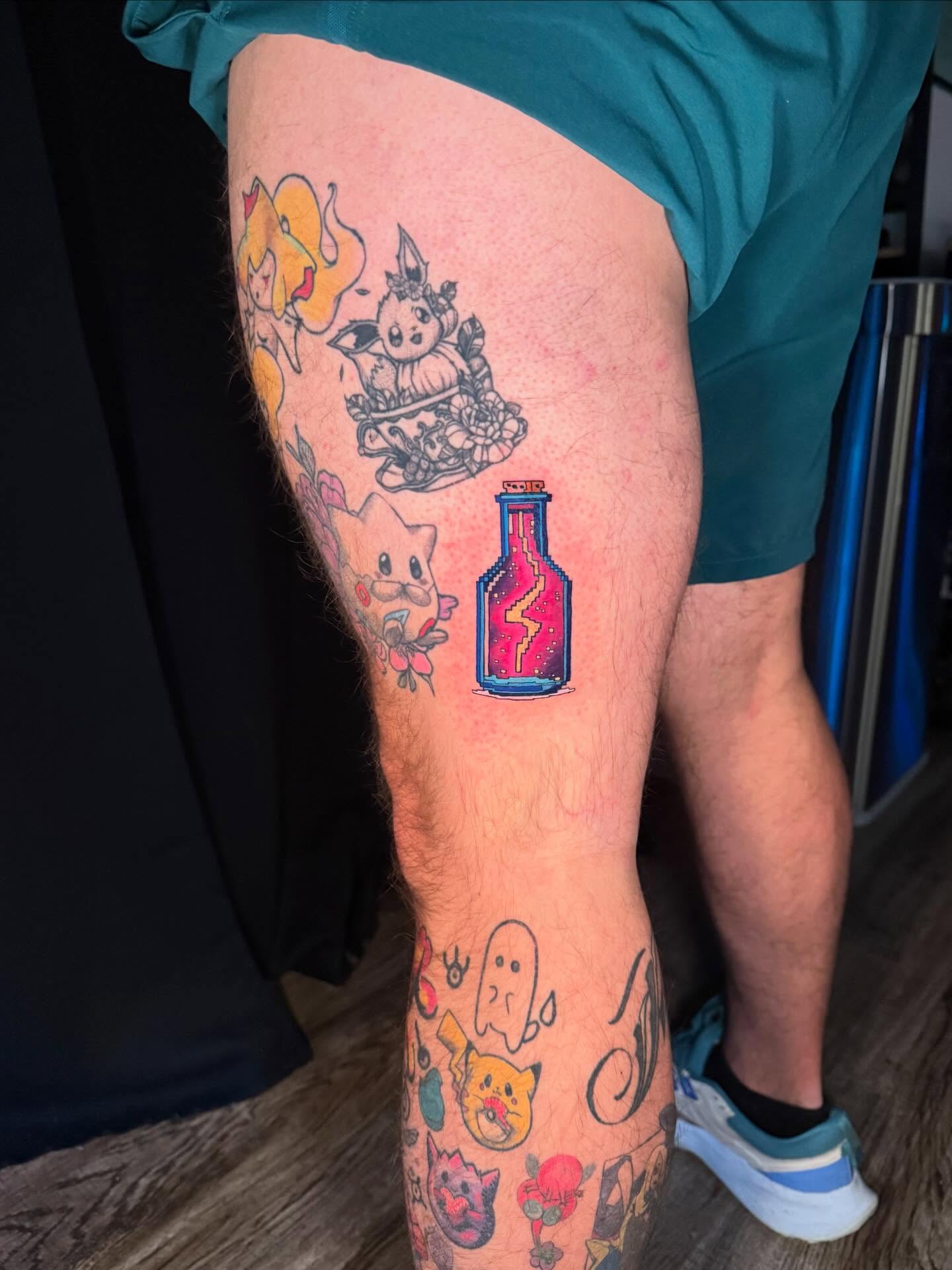 Anime characters anime tattoo on the thigh by Damon Moore