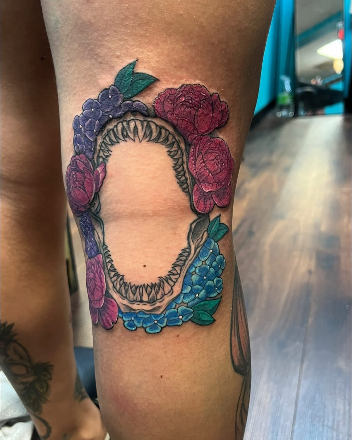 Skull with floral wreath American traditional tattoo on the forearm by Chelsea Nichole