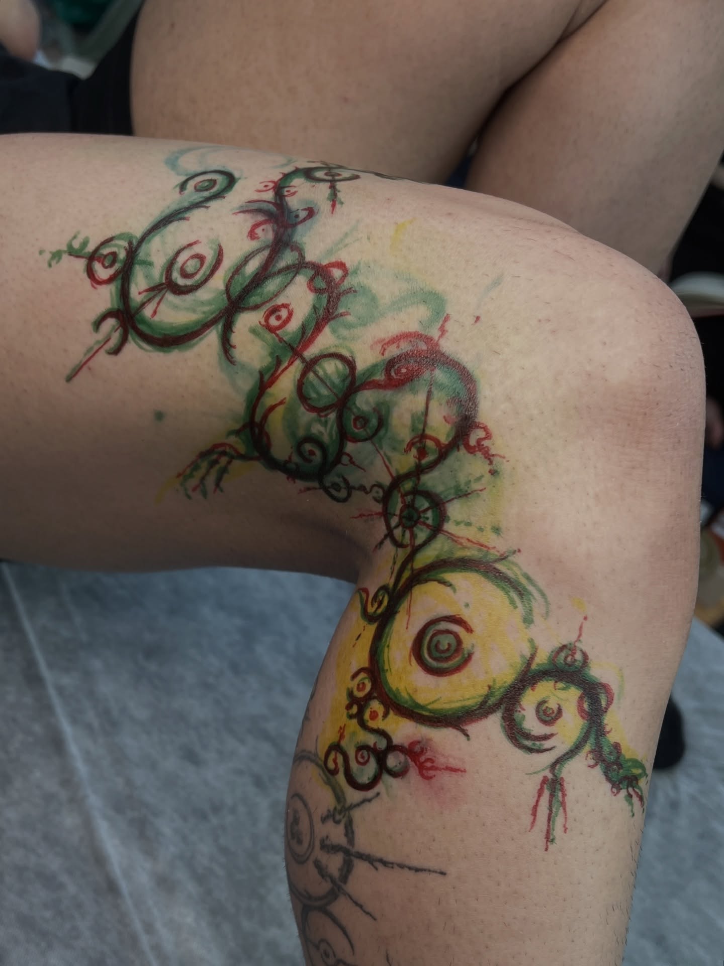 Abstract swirls watercolor tattoo on the thigh by HanaKaki