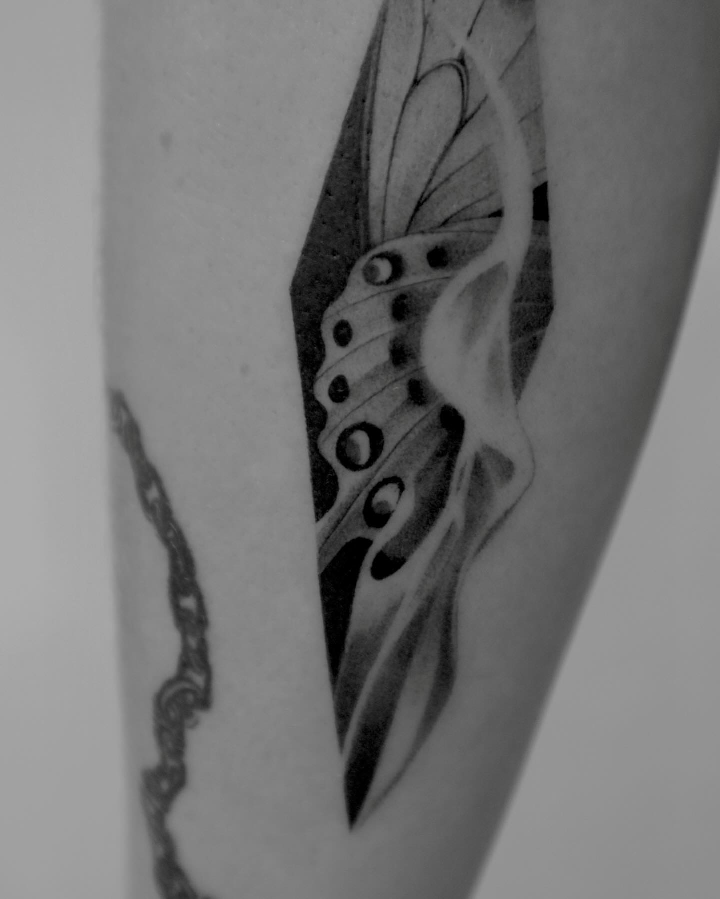 Butterfly geometric tattoo on the forearm by River, New York, New York
