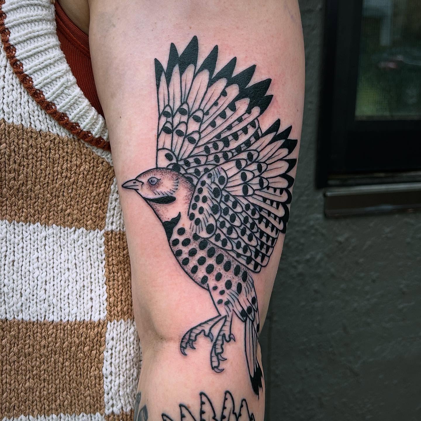 Bird black and grey tattoo on the forearm by Erica Finley