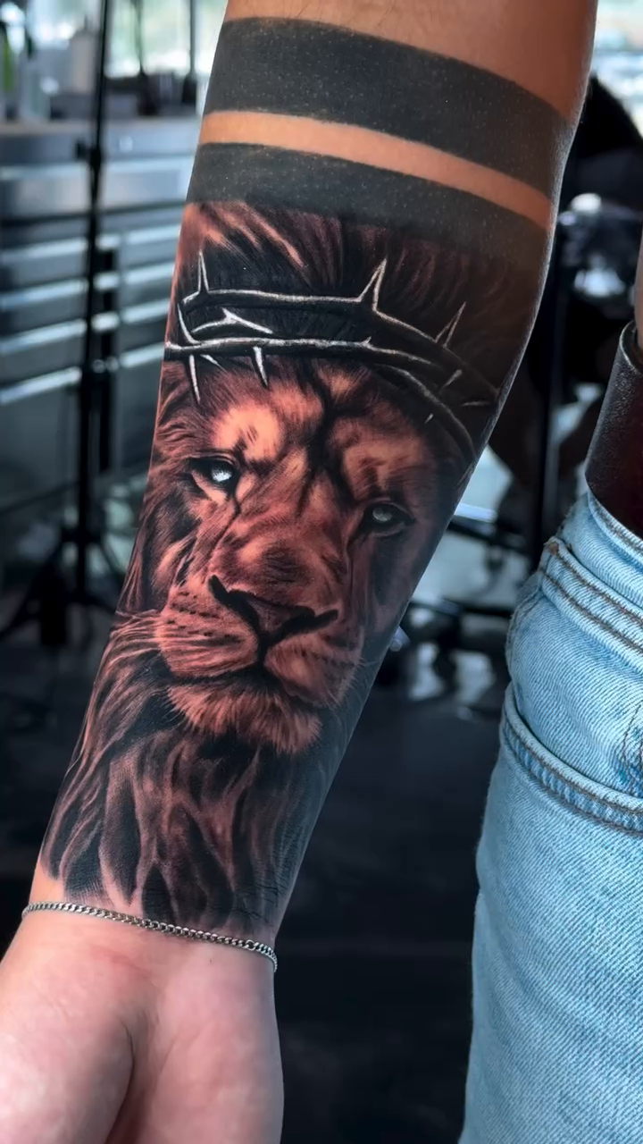 Lion with crown of thorns realism tattoo by Michael Sosa