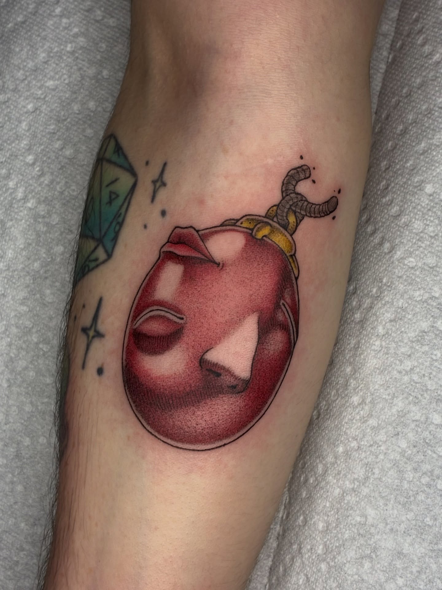 Apple with knife realism tattoo on the forearm by Lance 🦈